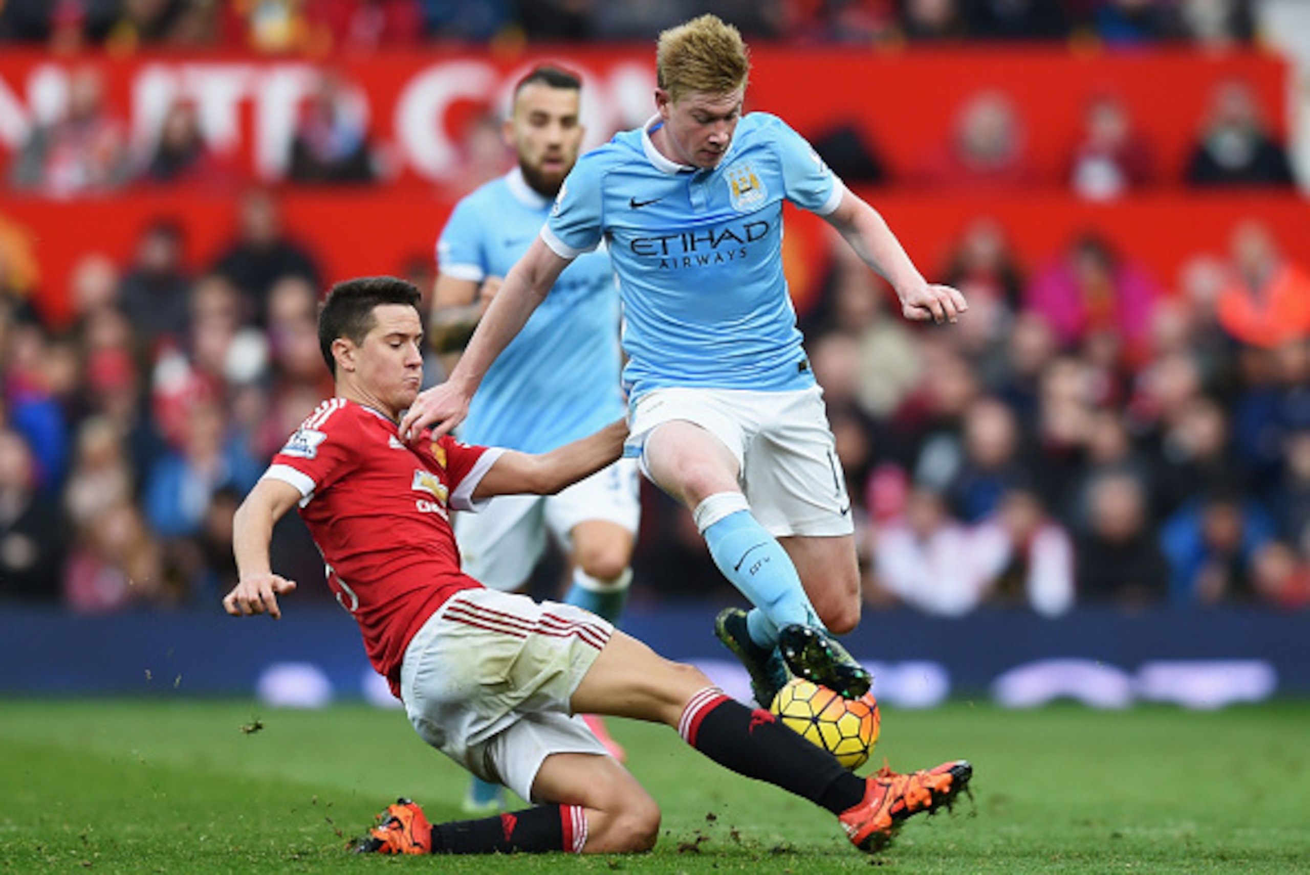 MANCHESTER, ENGLAND - OCTOBER 25:  Kevin de Bruyne of Manchester City is tackled by Ander Herrera of Manchester United during the Barclays Premier League match between Manchester United and Manchester City at Old Trafford on October 25, 2015 in Manchester