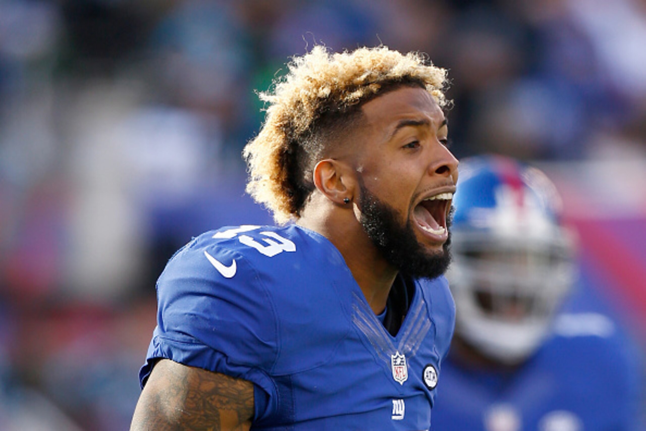 EAST RUTHERFORD, NJ - DECEMBER 20:  Odell Beckham #13 of the New York Giants reacts after a scuffle in the first quarter against the Carolina Panthers during their game at MetLife Stadium on December 20, 2015 in East Rutherford, New Jersey.  (Photo by Jef