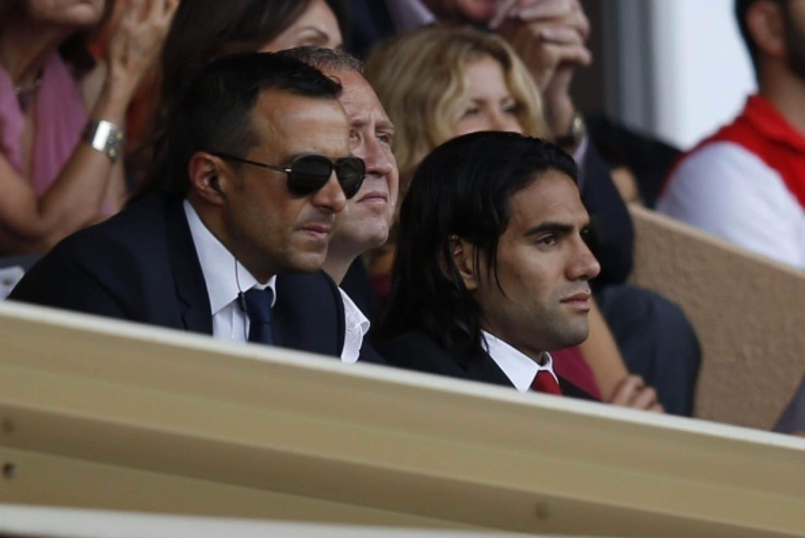 Monaco's Colombian forward Radamel Falcao (R) and his agent Jorge Mendes (L) watch from the tribunes the French L1 football match Monaco (ASM) vs Lille (LOSC) on August 30, 2014 at the Louis II stadium in Monaco. Radamel Falcao was dropped at the last min