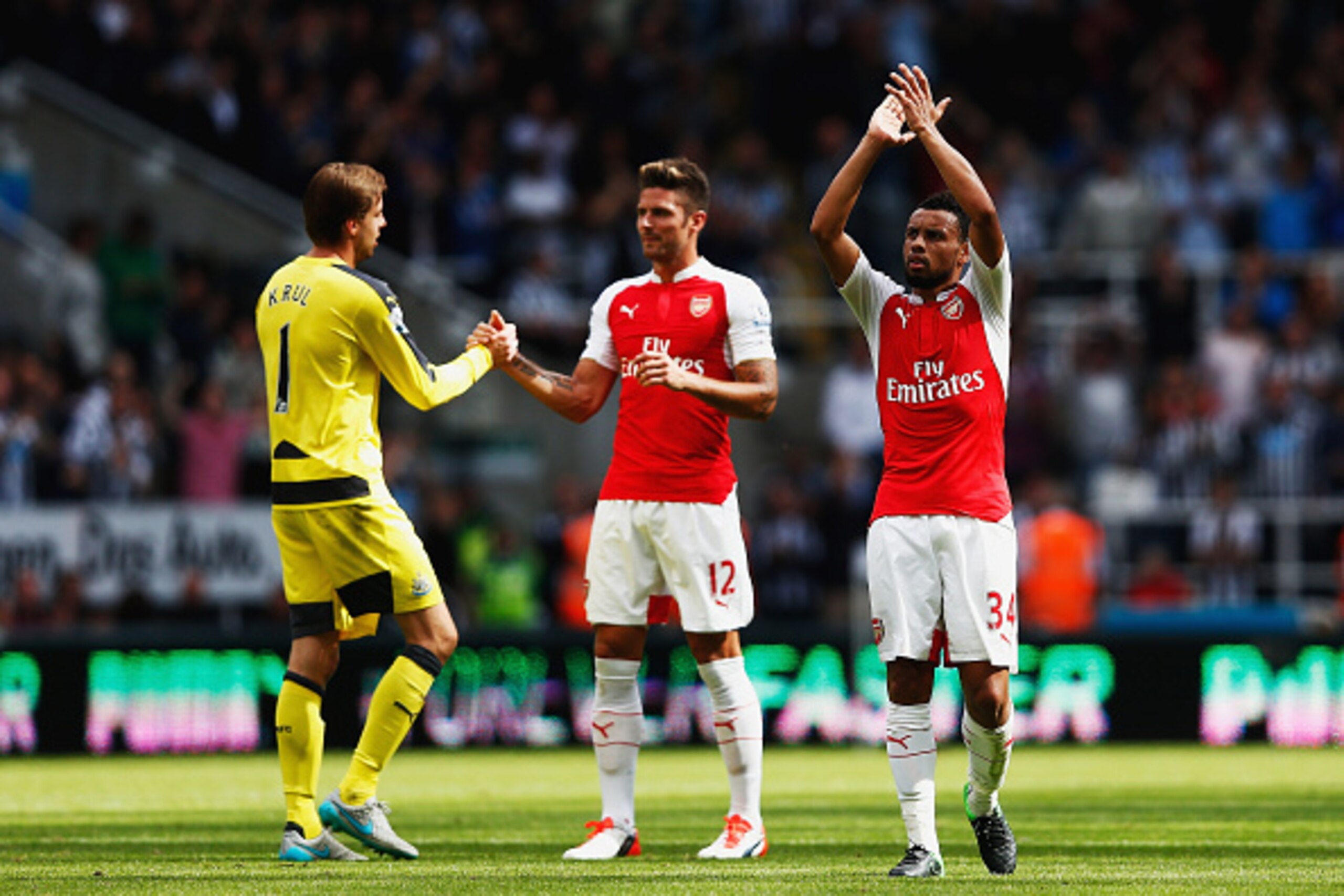 NEWCASTLE UPON TYNE, ENGLAND - AUGUST 29: Francis Coquelin of Arsenal celebrates his team's 1-0 win while Olivier Giroud of Arsenal consoles Tim Krul of Newcastle United after the Barclays Premier League match between Newcastle United and Arsenal at St Ja