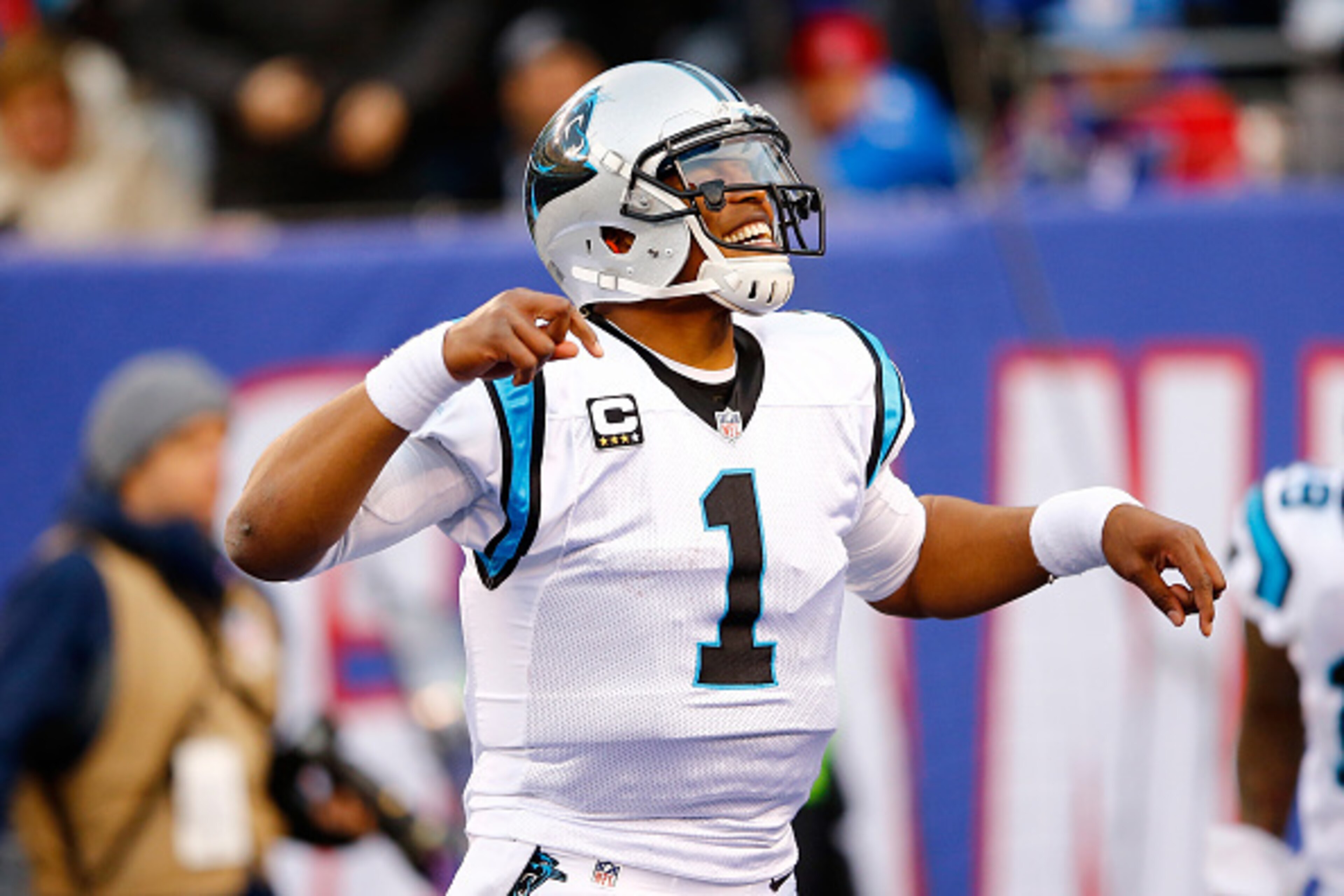 EAST RUTHERFORD, NJ - DECEMBER 20:  Cam Newton #1 of the Carolina Panthers celebrates a touchdown in the third quarter against the New York Giants during their game at MetLife Stadium on December 20, 2015 in East Rutherford, New Jersey.  (Photo by Michael