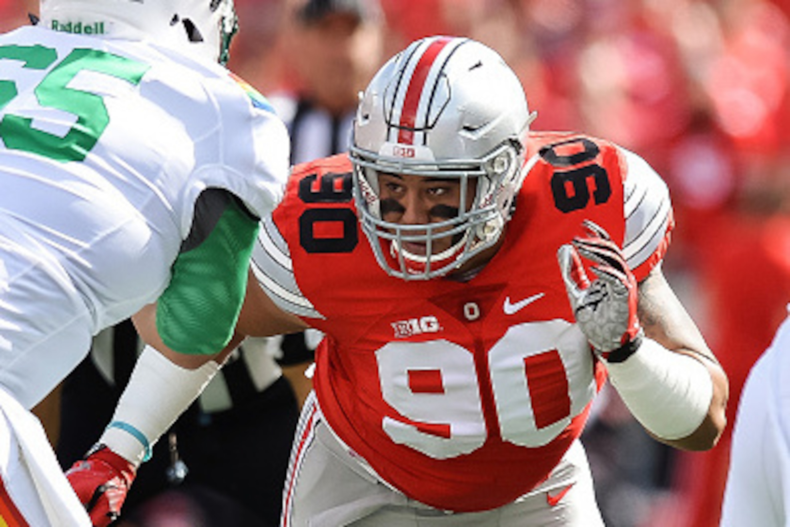 COLUMBUS, OH - SEPTEMBER 12:  Tommy Schutt #90 of the Ohio State Buckeyes takes off the line against the Hawaii Rainbow Warriors at Ohio Stadium on September 12, 2015 in Columbus, Ohio.  (Photo by Jamie Sabau/Getty Images)