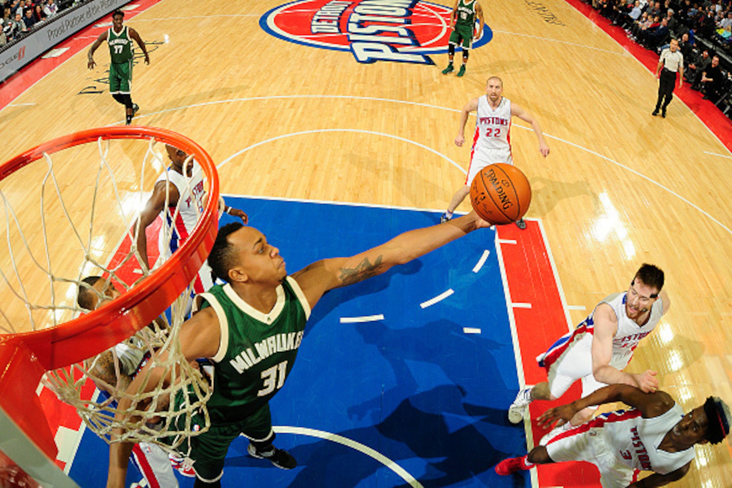 AUBURN HILLS, MI - DECEMBER 4:  John Henson #31 of the Milwaukee Bucks grabs the rebound against the Detroit Pistons on December 4, 2015 at The Palace of Auburn Hills in Auburn Hills, Michigan. NOTE TO USER: User expressly acknowledges and agrees that, by