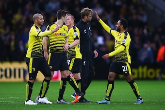 WATFORD, ENGLAND - DECEMBER 20:  Jurgen Klopp manager of Liverpool looks dejected in defeat as Watford players celebrate after the Barclays Premier League match between Watford and Liverpool at Vicarage Road on December 20, 2015 in Watford, England.  (Pho