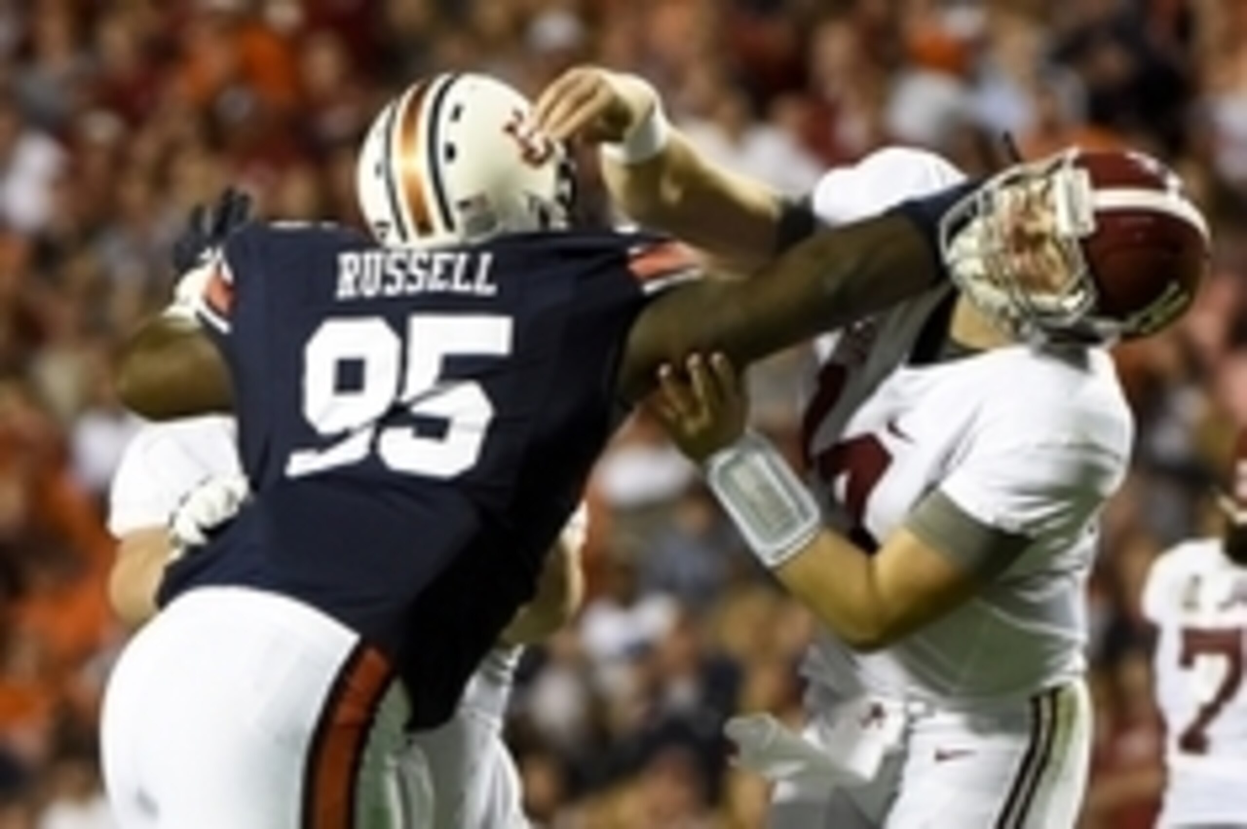 Nov 28, 2015; Auburn, AL, USA; Auburn Tigers defensive lineman Dontavius Russell (95) defends Alabama Crimson Tide quarterback Jake Coker (14) during the third quarter at Jordan Hare Stadium. Mandatory Credit: Shanna Lockwood-USA TODAY Sports