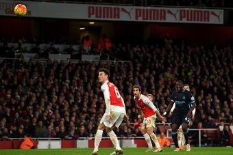 LONDON, ENGLAND - DECEMBER 21:  Yaya Toure of Manchester City (r) scores his side's first goal during the Barclays Premier League match between Arsenal and Manchester City at Emirates Stadium on December 21, 2015 in London, England.  (Photo by Michael Reg