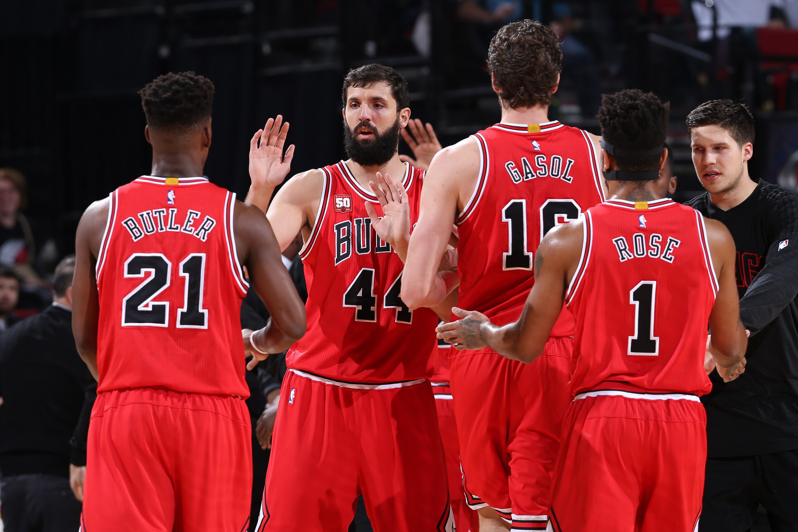 PORTLAND, OR - NOVEMBER 24:  Jimmy Butler #21, Nikola Mirotic #44, Pau Gasol #16 and Derrick Rose #1 of the Chicago Bulls high five against the Portland Trail Blazers on November 24, 2015 at the Moda Center Arena in Portland, Oregon. NOTE TO USER: User ex