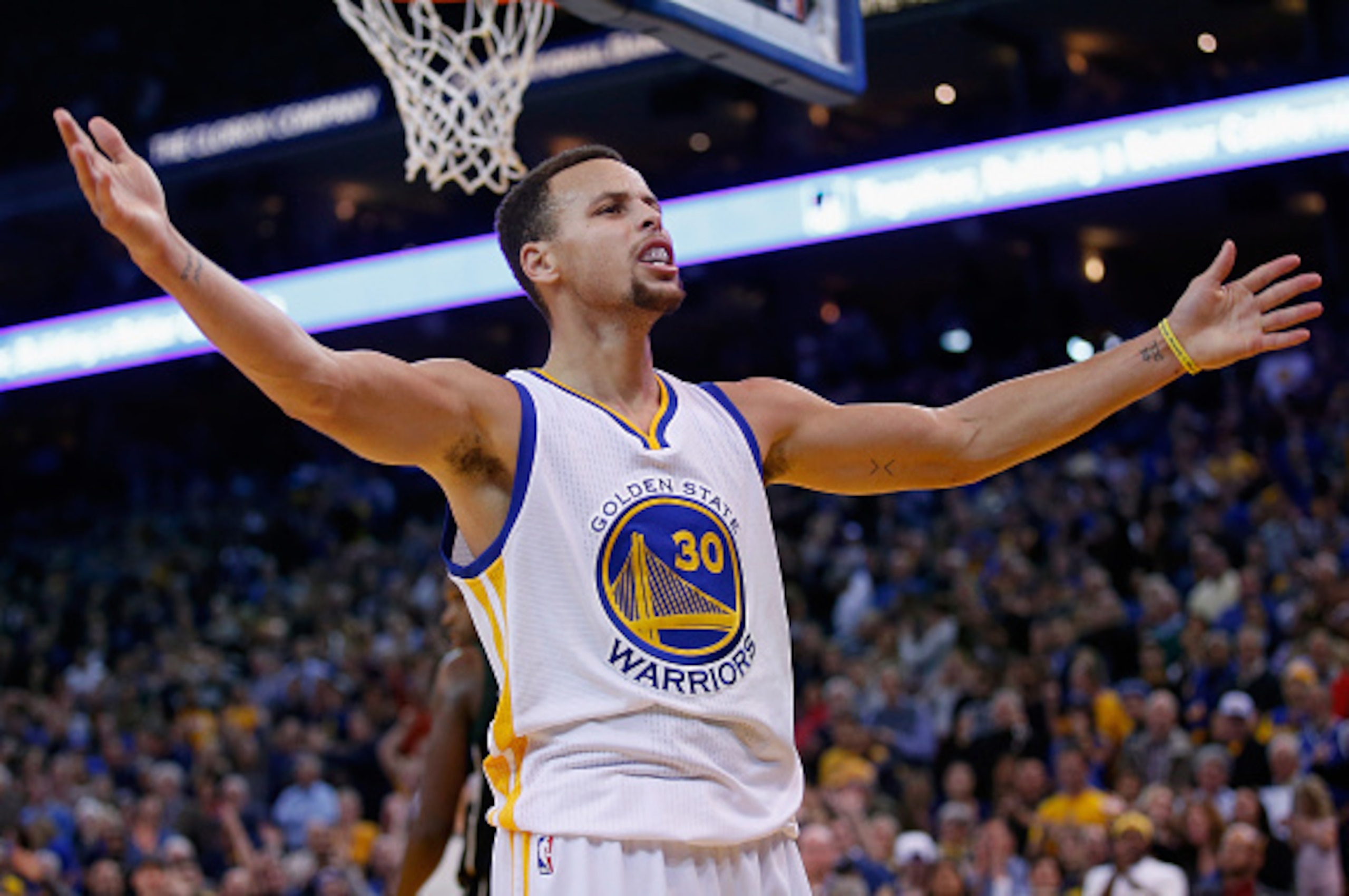 OAKLAND, CA - DECEMBER 18:  Stephen Curry #30 of the Golden State Warriors reacts towards the crowd during their game against the Milwaukee Bucks at ORACLE Arena on December 18, 2015 in Oakland, California. NOTE TO USER: User expressly acknowledges and ag