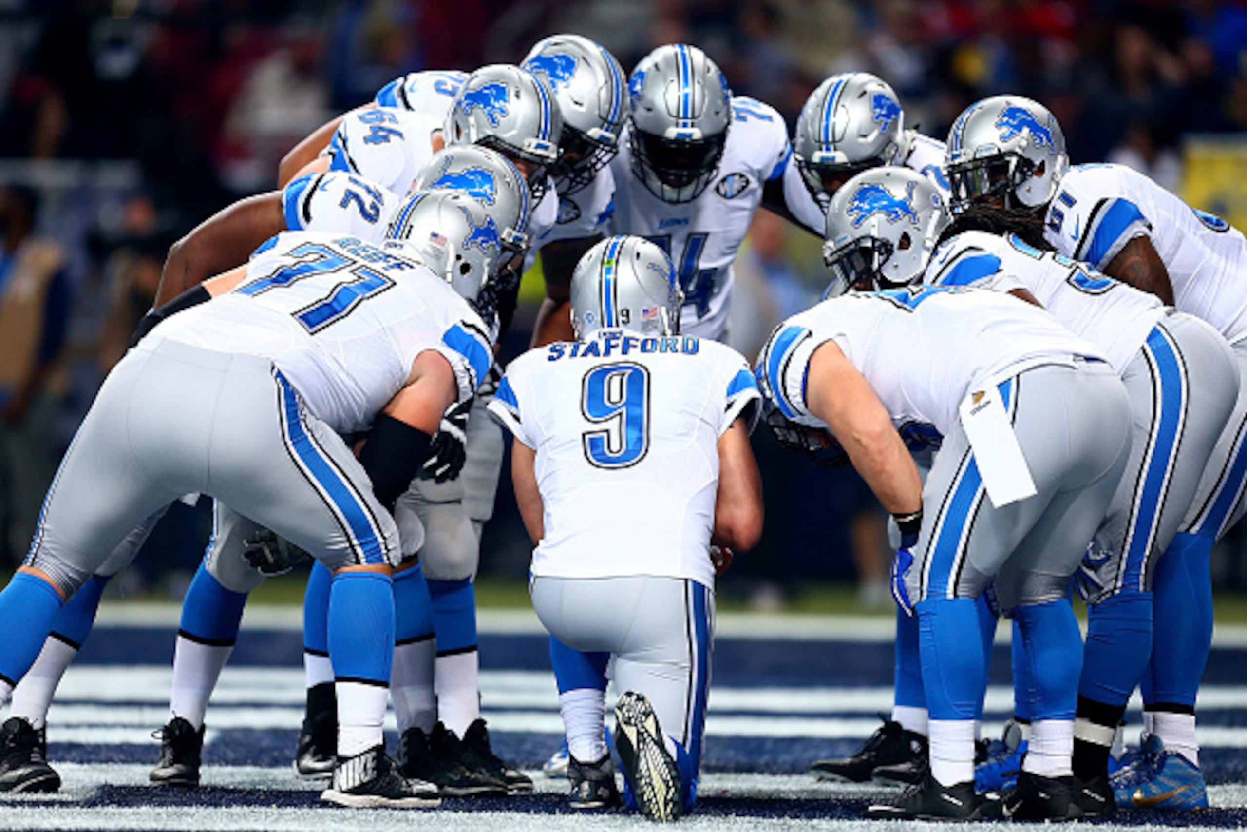 ST. LOUIS, MO - DECEMBER 13: The Detroit Lions huddles around Matthew Stafford #9 in the second quarter against the St. Louis Rams at the Edward Jones Dome on December 13, 2015 in St. Louis, Missouri. (Photo by Dilip Vishwanat/Getty Images)