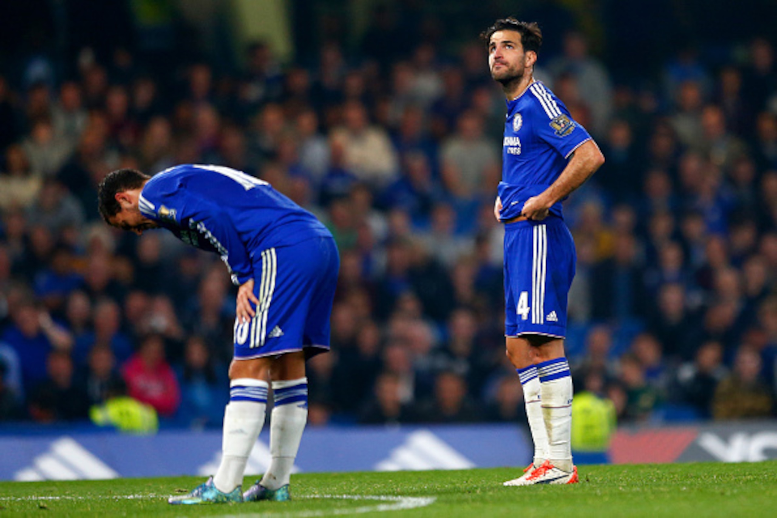 LONDON, ENGLAND - OCTOBER 03:  Eden Hazard of Chelsea and Sesc Fabregas of Chelsea show their dejection after conceding the third goal to Southampton during the Barclays Premier League match between Chelsea and Southampton at Stamford Bridge on October 3,