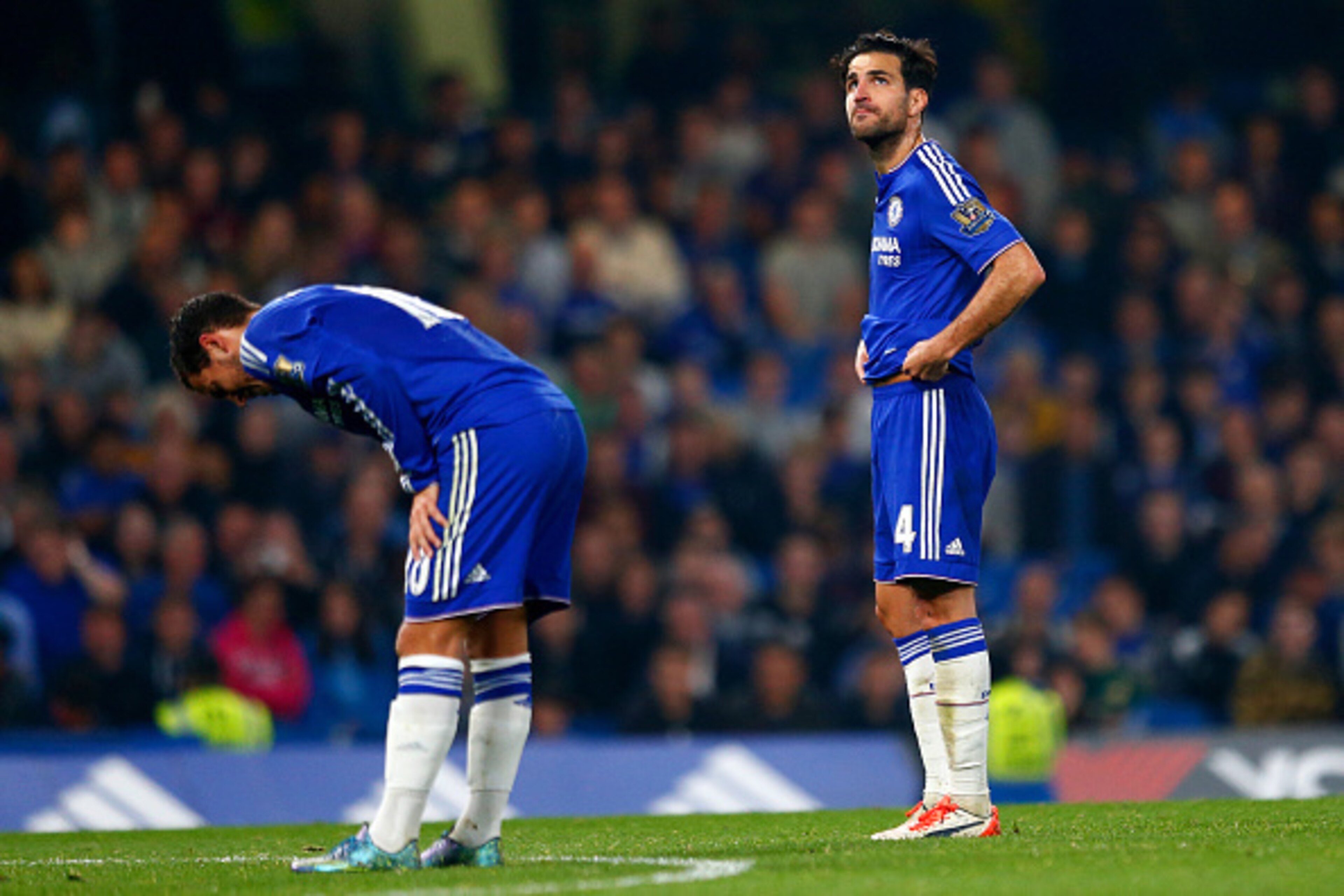 LONDON, ENGLAND - OCTOBER 03:  Eden Hazard of Chelsea and Sesc Fabregas of Chelsea show their dejection after conceding the third goal to Southampton during the Barclays Premier League match between Chelsea and Southampton at Stamford Bridge on October 3,
