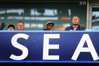 LONDON, ENGLAND - DECEMBER 19:  Chelsea interim manager Guus Hiddink (L), Didier Drogba (C) of Montreal Impact and Chelsea owner Roman Abramovich (R) are seen on the stand prior to the Barclays Premier League match between Chelsea and Sunderland at Stamfo