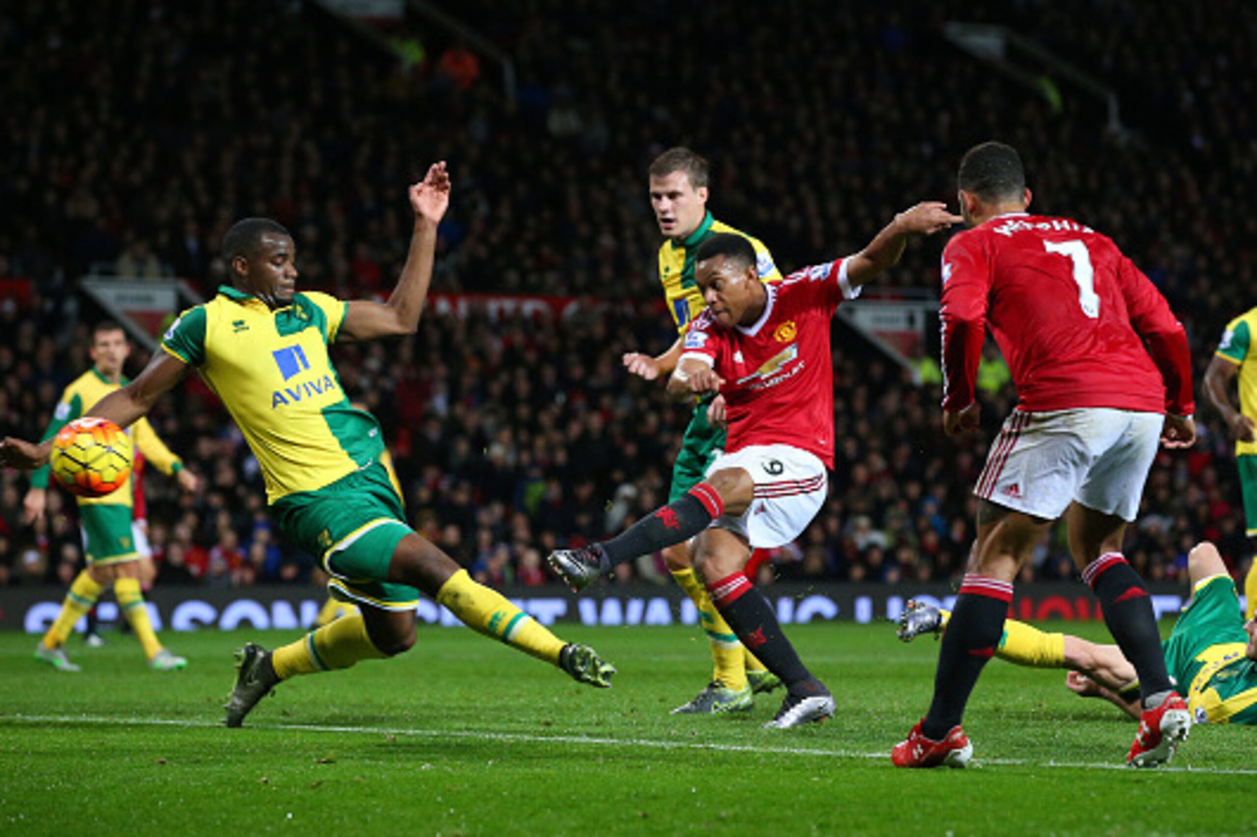 MANCHESTER, ENGLAND - DECEMBER 19: Anthony Martial of Manchester United scores his team's first goal during the Barclays Premier League match between Manchester United and Norwich City at Old Trafford on December 19, 2015 in Manchester, England.  (Photo b