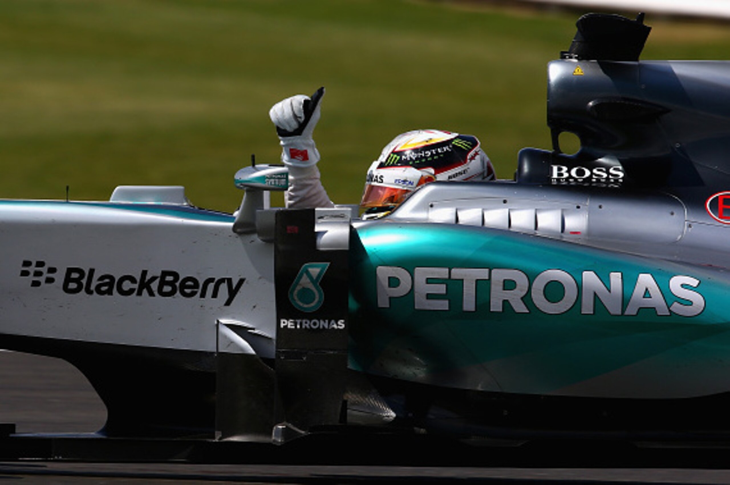 NORTHAMPTON, ENGLAND - JULY 05:  Lewis Hamilton of Great Britain and Mercedes GP celebrates in the car after winning the Formula One Grand Prix of Great Britain at Silverstone Circuit on July 5, 2015 in Northampton, England.  (Photo by Clive Mason/Getty I
