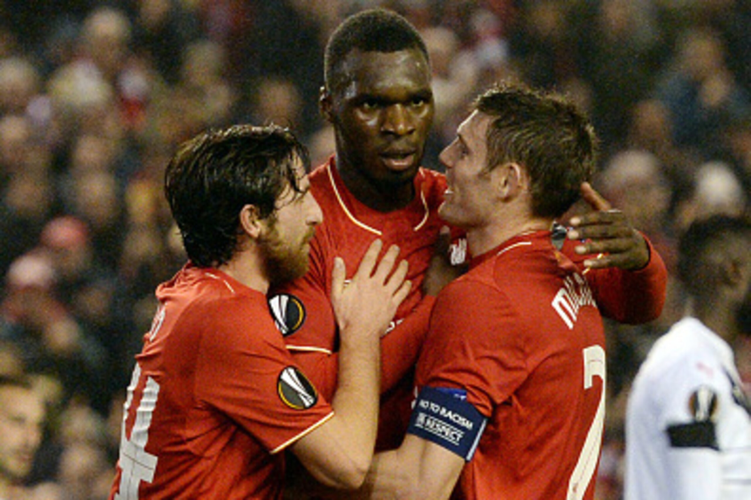 Liverpool's Zaire-born Belgian striker Christian Benteke (C) celebrates with Liverpool's Welsh midfielder Joe Allen (L) and Liverpool's English midfielder James Milner after scoring during a UEFA Europa League group B football match between Liverpool and 