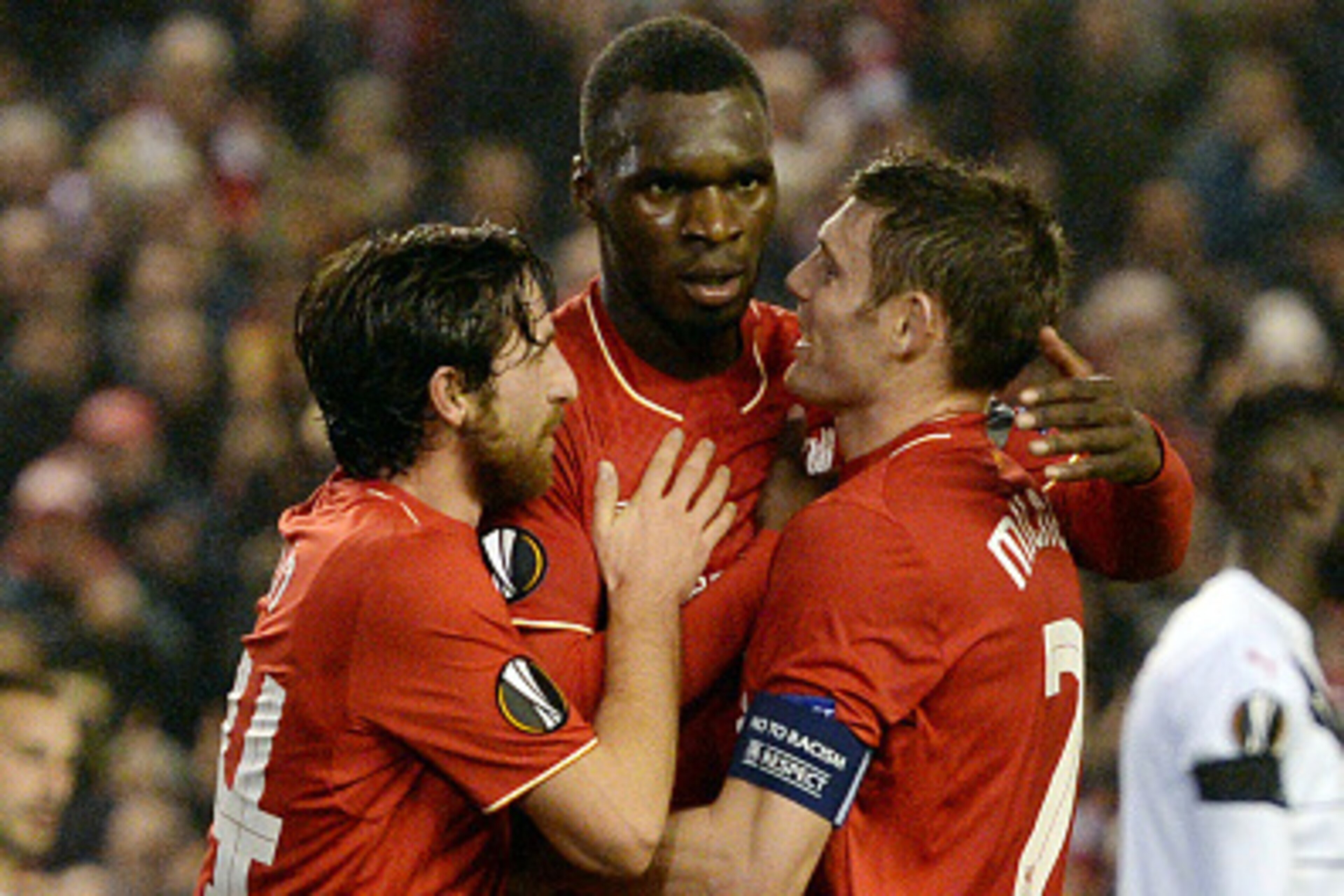 Liverpool's Zaire-born Belgian striker Christian Benteke (C) celebrates with Liverpool's Welsh midfielder Joe Allen (L) and Liverpool's English midfielder James Milner after scoring during a UEFA Europa League group B football match between Liverpool and 