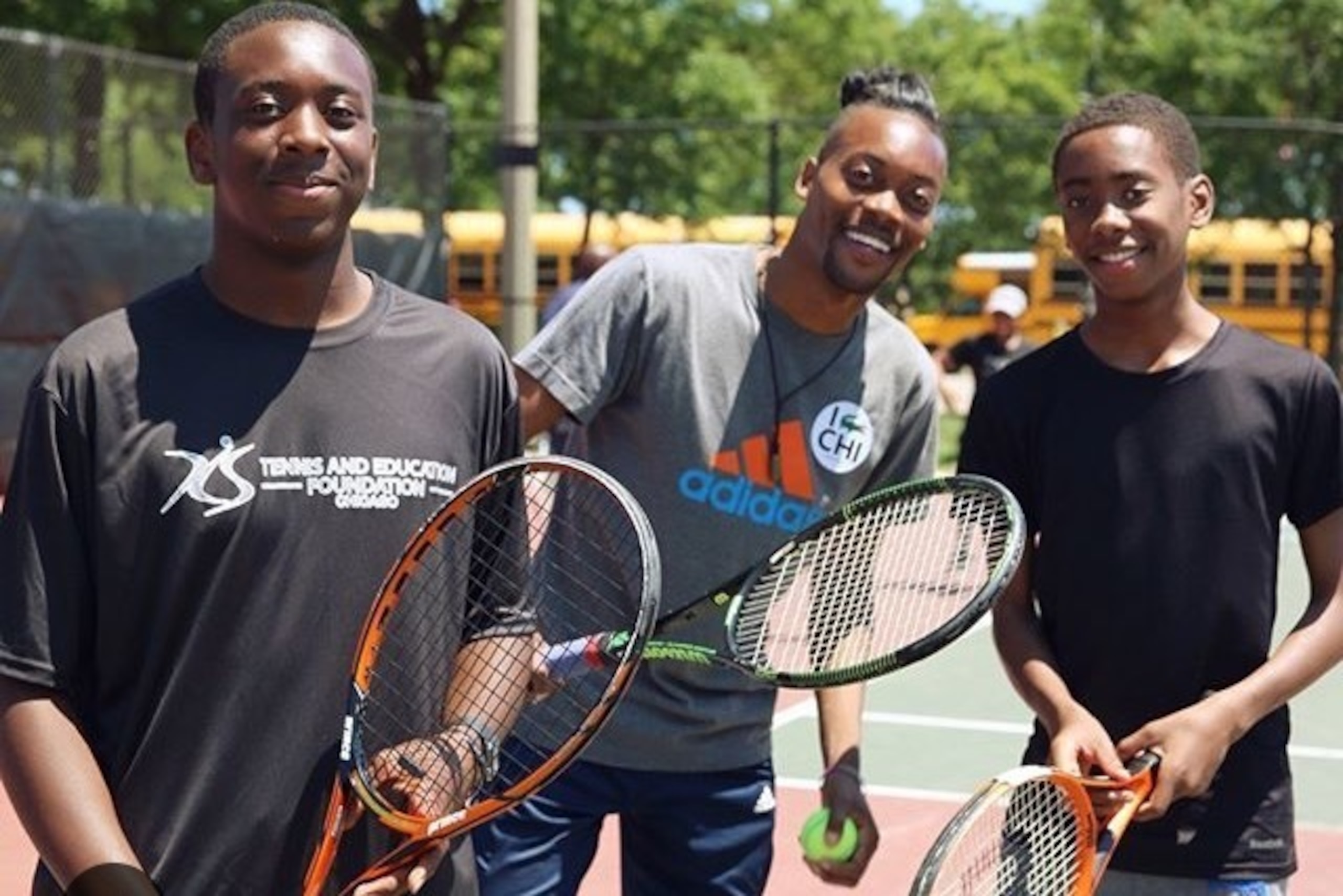 Lendale Johnson (middle) works with area Chicago youth at a local event.
