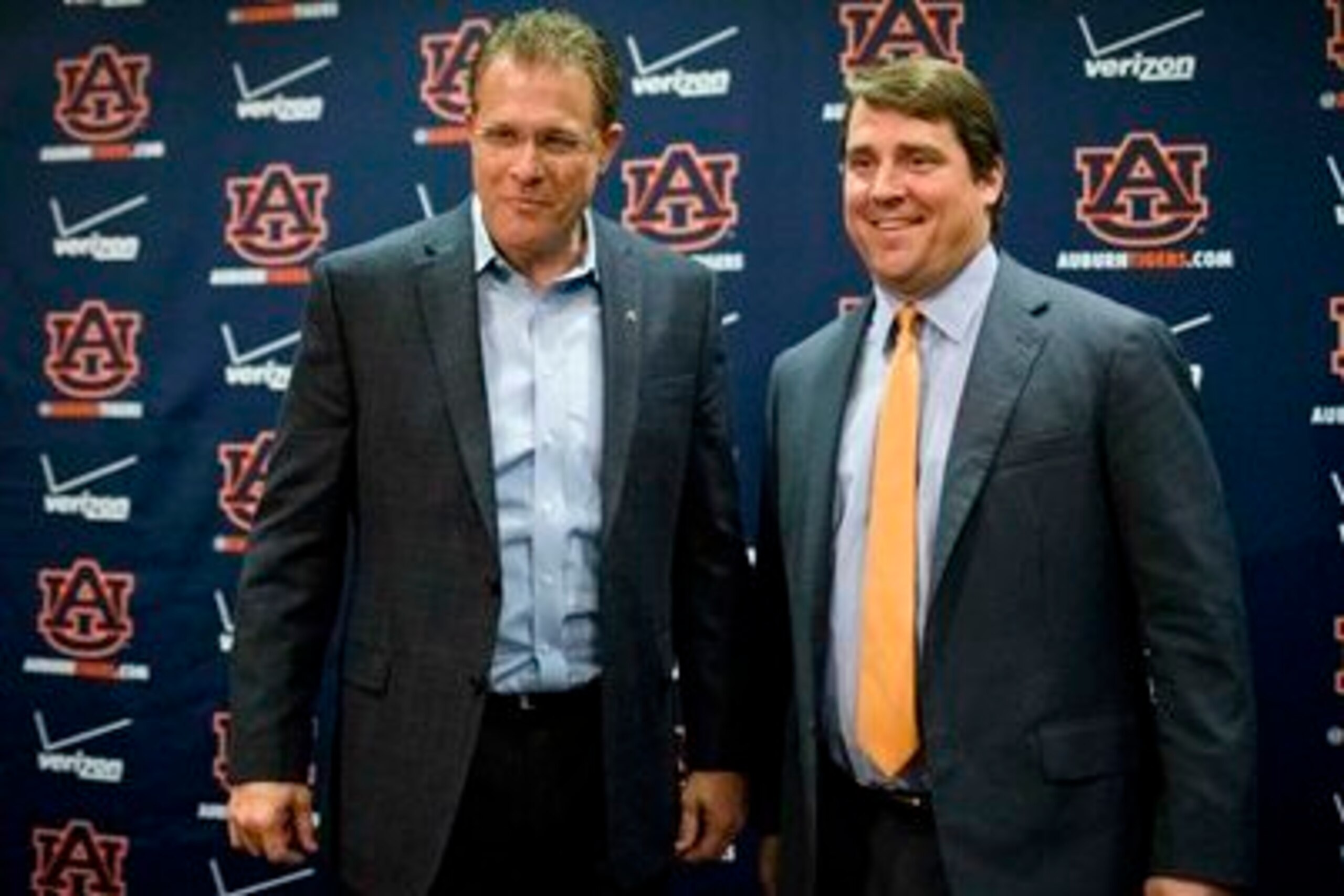 Auburn head coach Gus Malzahn (left) and South Carolina head coach Will Muschamp (right) in December 2014