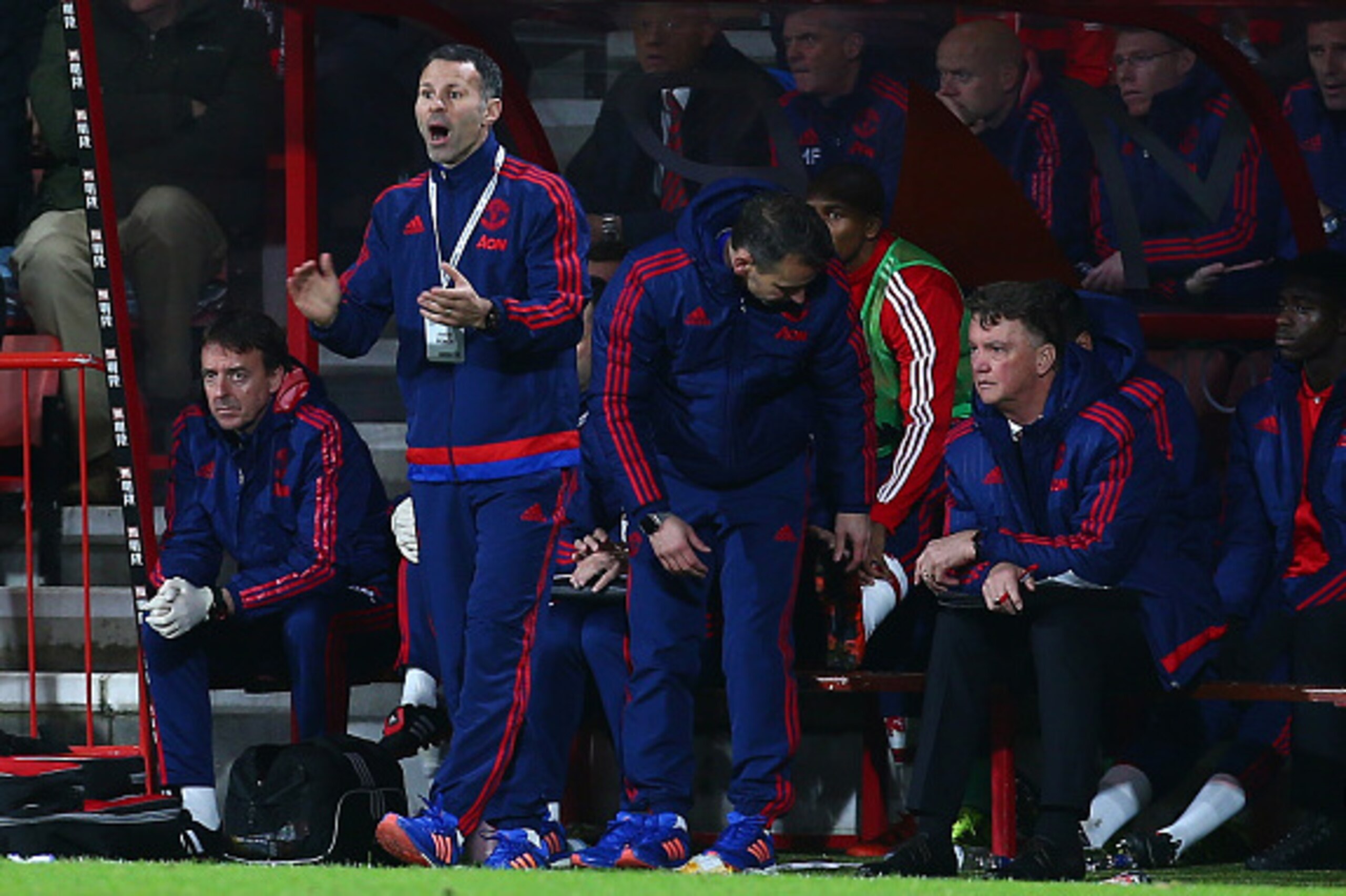 BOURNEMOUTH, ENGLAND - DECEMBER 12: Assistant manager Ryan Giggs of Manchester Untied gestures while manager Louis van Gaal stays on the bench during the Barclays Premier League match between A.F.C. Bournemouth and Manchester United at Vitality Stadium on