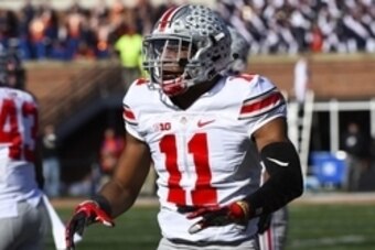 Nov 14, 2015; Champaign, IL, USA; Ohio State Buckeyes safety Vonn Bell (11) reacts after a tackle against the Illinois Fighting Illini during the second quarter at Memorial Stadium. Mandatory Credit: Mike DiNovo-USA TODAY Sports