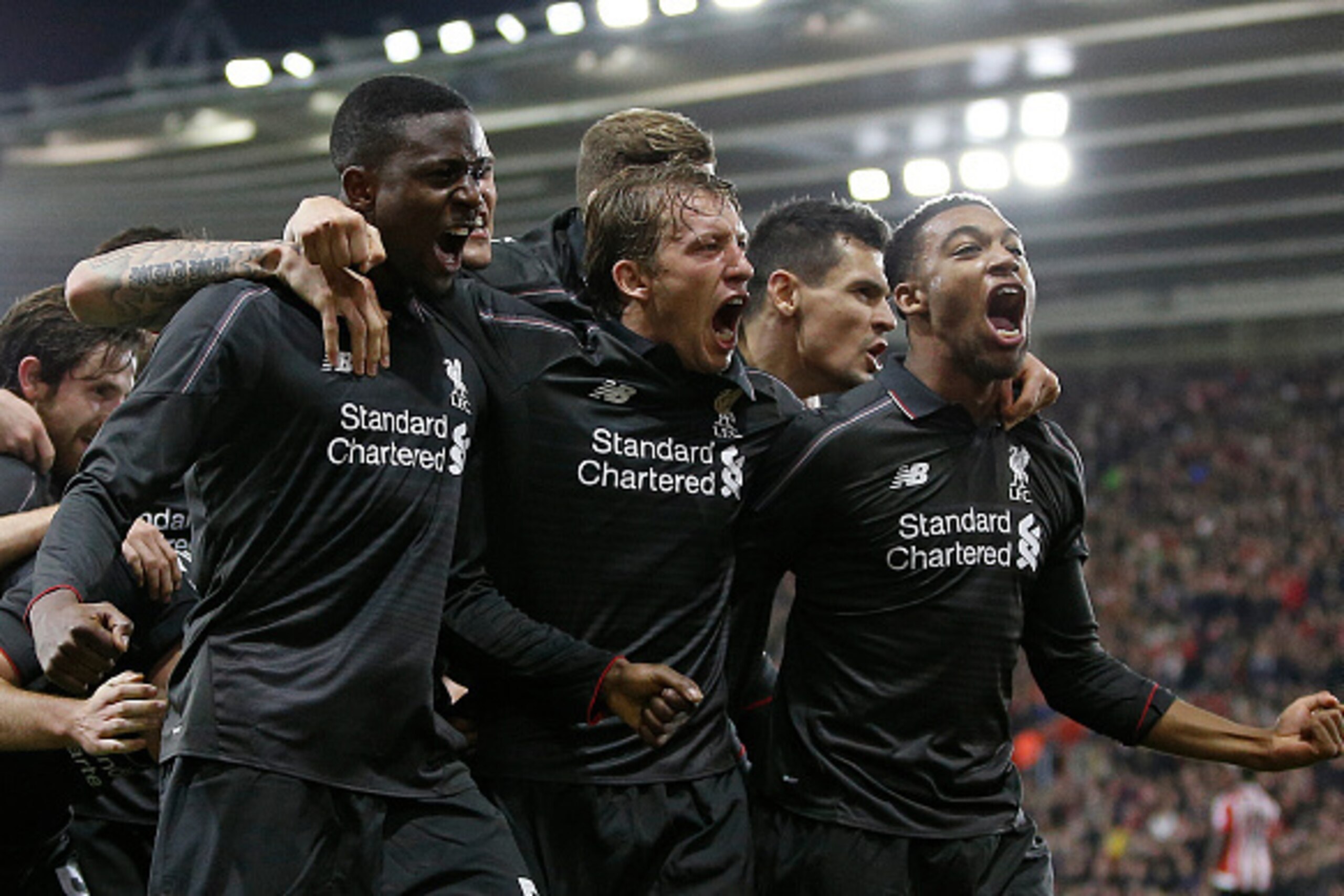 Liverpool's Belgian striker Divock Origi (L) celebrates scoring his team's fourth goal with Liverpool's English midfielder Jordon Ibe (R) during the English League Cup quarter-final football match between Southampton and Liverpool at St Mary's Stadium in 