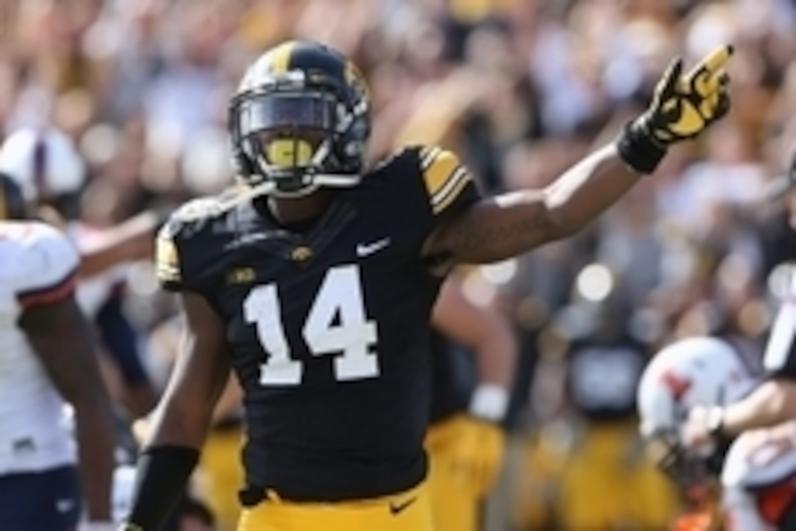 Oct 10, 2015; Iowa City, IA, USA; Iowa Hawkeyes defensive back Desmond King (14) signals for the first down late in the fourth quarter after Iowa recovered a fumble against the Illinois Fighting Illini at Kinnick Stadium. Iowa beat Illinois 29-20.  Mandat