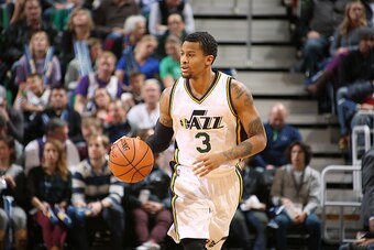 SALT LAKE CITY, UT - DECEMBER 21:  Trey Burke #3 of the Utah Jazz handles the ball against the Phoenix Suns on December 21, 2015 at vivint.SmartHome Arena in Salt Lake City, Utah. NOTE TO USER: User expressly acknowledges and agrees that, by downloading a