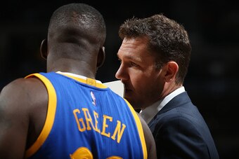 DENVER, CO - NOVEMBER 22:  Interim head coach Luke Walton of the Golden State Warriors talks to Draymond Green #23 of the Golden State Warriors as they face the Denver Nuggets at Pepsi Center on November 22, 2015 in Denver, Colorado. The Warriors defeated