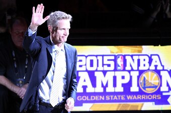 OAKLAND, CA - OCTOBER 27:  Head coach Steve Kerr of the Golden State Warriors waves to the crowd during the championship ring ceremony prior to their NBA season opener against the New Orleans Pelicans at ORACLE Arena on October 27, 2015 in Oakland, Califo