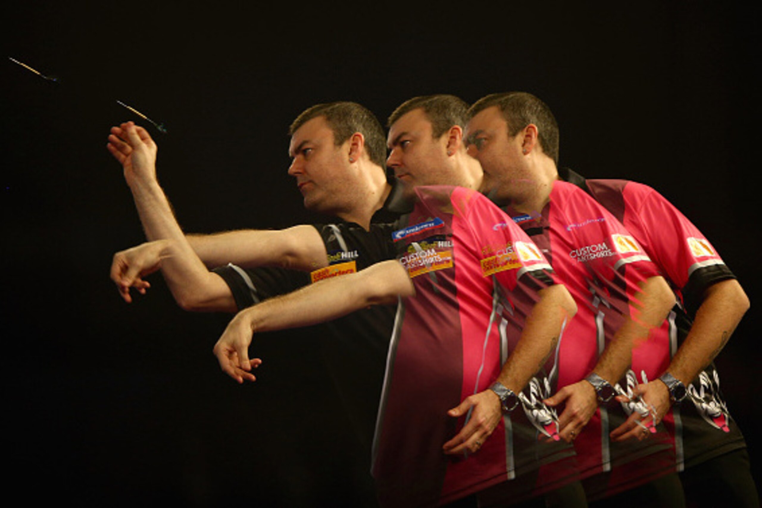 LONDON, ENGLAND - DECEMBER 22:  (EDITORS NOTE: This image was created using multiple exposure) Wes Newton of England in action during his match against Cristo Reyes of Spain of Spain during the 2016 William Hill PDC World Darts Championships on Day Five a
