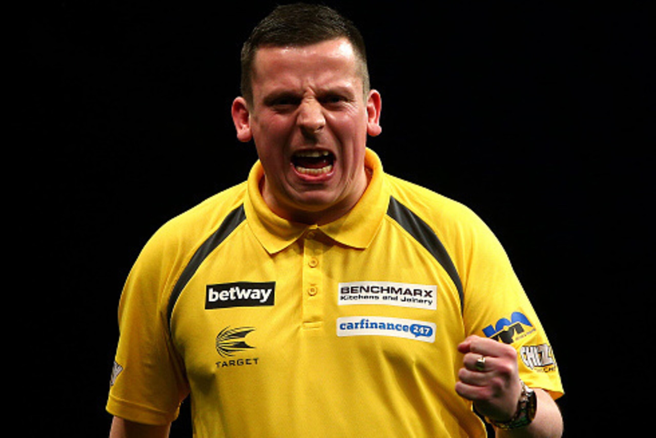 LONDON, ENGLAND - MAY 21: Dave Chisnall of England celebrates winning a leg during his semi-final match against Gary Anderson of Scotland during the Betway Premier League at The 02 Arena on May 21, 2015 in London, England. (Photo by Charlie Crowhurst/Gett