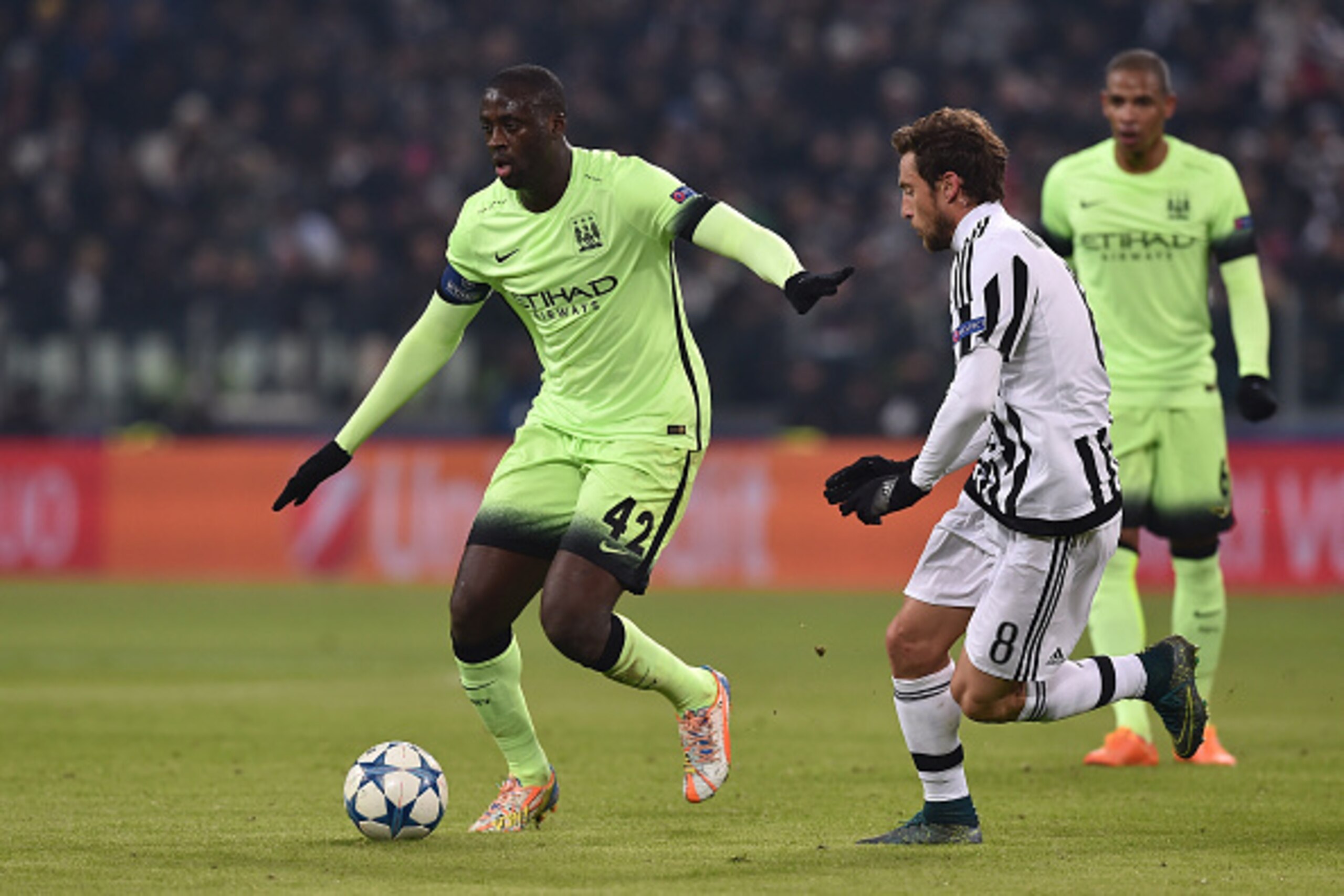 TURIN, ITALY - NOVEMBER 25: Yaya Toure (L) of Manchester City FC in action against Claudio Marchisio of Juventus during the UEFA Champions League group stage match between Juventus and Manchester City FC at Juventus Arena on November 25, 2015 in Turin, I TURIN, ITALY - NOVEMBER 25: Yaya Toure (L) of Manchester City FC in action against Claudio Marchisio of Juventus during the UEFA Champions League group stage match between Juventus and Manchester City FC at Juventus Arena on November 25, 2015 in Turin, I