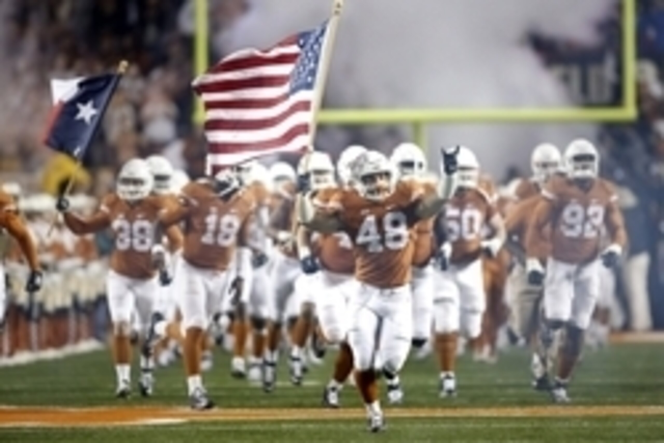 Nov 7, 2015; Austin, TX, USA; University of Texas Longhorns tight end Dominic Cruciani (48) carries out the American flag before the game against the University of Kansas Jayhawks at Darrell K Royal-Texas Memorial Stadium. Mandatory Credit: Erich Schlegel