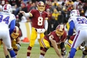 Dec 20, 2015; Landover, MD, USA; Washington Redskins quarterback Kirk Cousins (8) looks over the line of scrimmage against the Buffalo Bills during the second half at FedEx Field. Mandatory Credit: Brad Mills-USA TODAY Sports