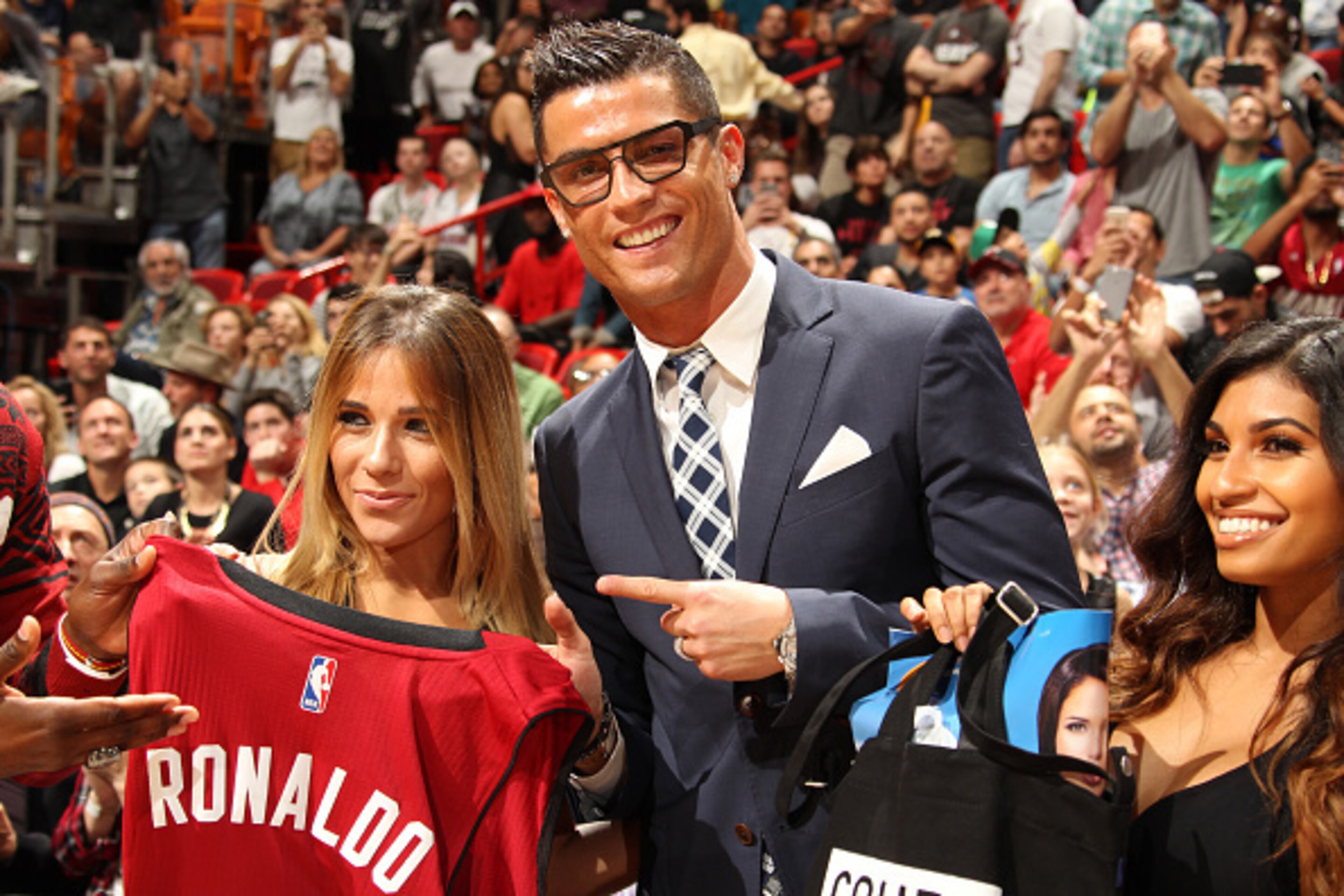 MIAMI, FL - DECEMBER 22: Cristiano Ronaldo, Portuguese professional soccer player is honored with a Miami Heat jersey at the Miami Heat game against Detroit Pistons on December 22, 2015 at American Airlines Arena in Miami, Florida. NOTE TO USER: User expr