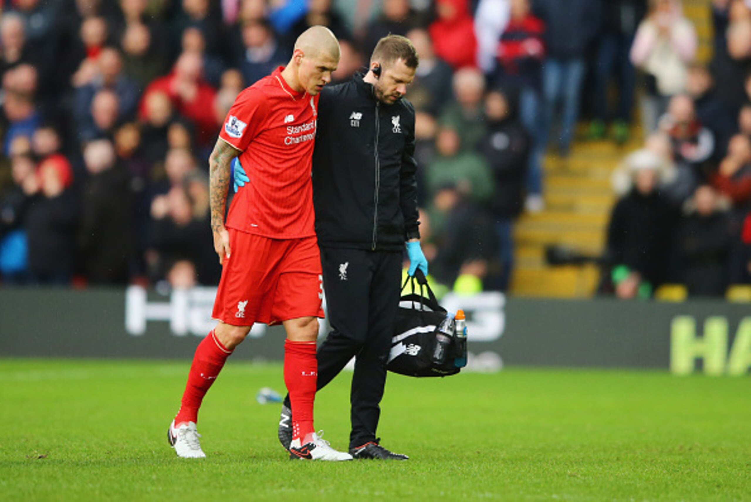 WATFORD, ENGLAND - DECEMBER 20:  An injured Martin Skrtel of Liverpool is given assitance as he is substituted during the Barclays Premier League match between Watford and Liverpool at Vicarage Road on December 20, 2015 in Watford, England.  (Photo by Ric