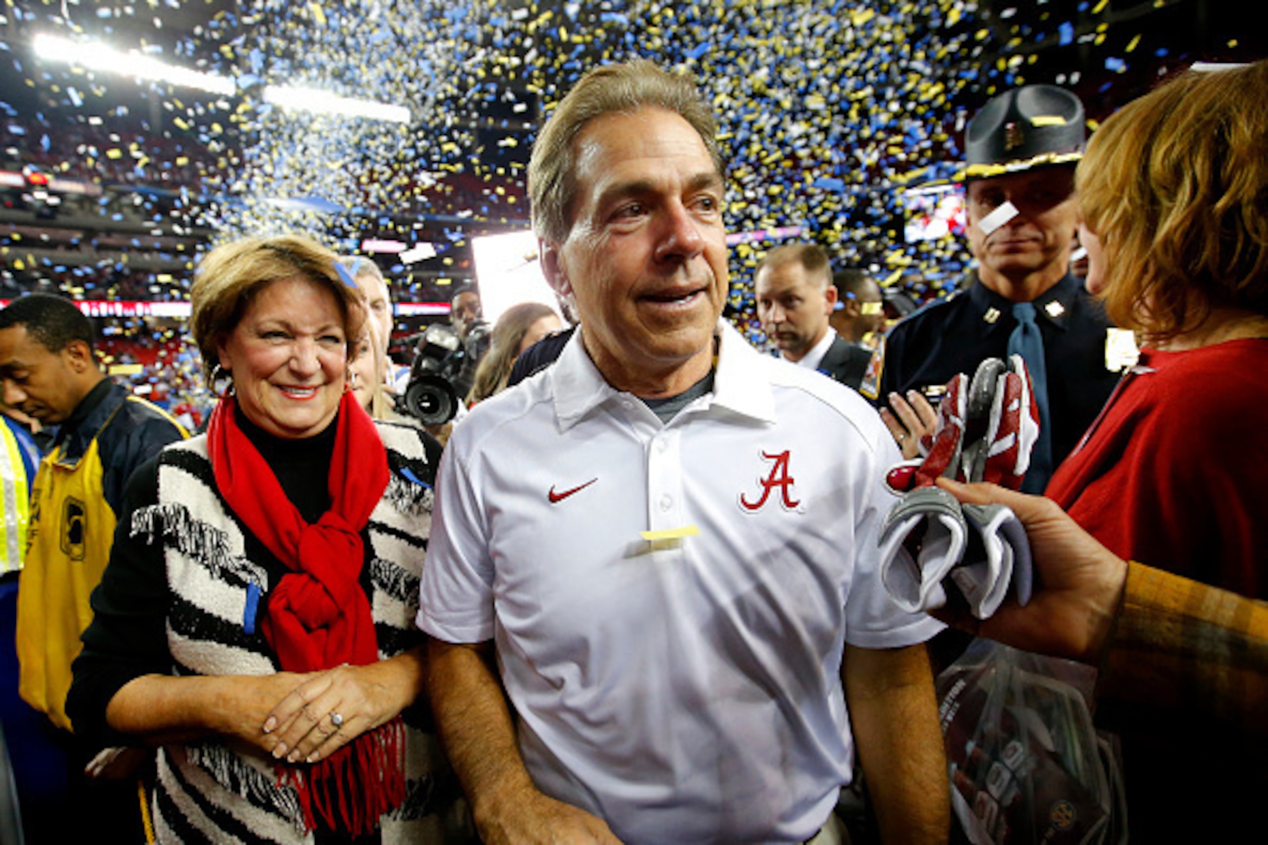 ATLANTA, GA - DECEMBER 5: Head coach Nick Saban of the Alabama Crimson Tide celebrates with his wife Terry Saban after defeating the Florida Gators 29-15 in the SEC Championship game at the Georgia Dome on December 5, 2015 in Atlanta, Georgia. (Photo by K