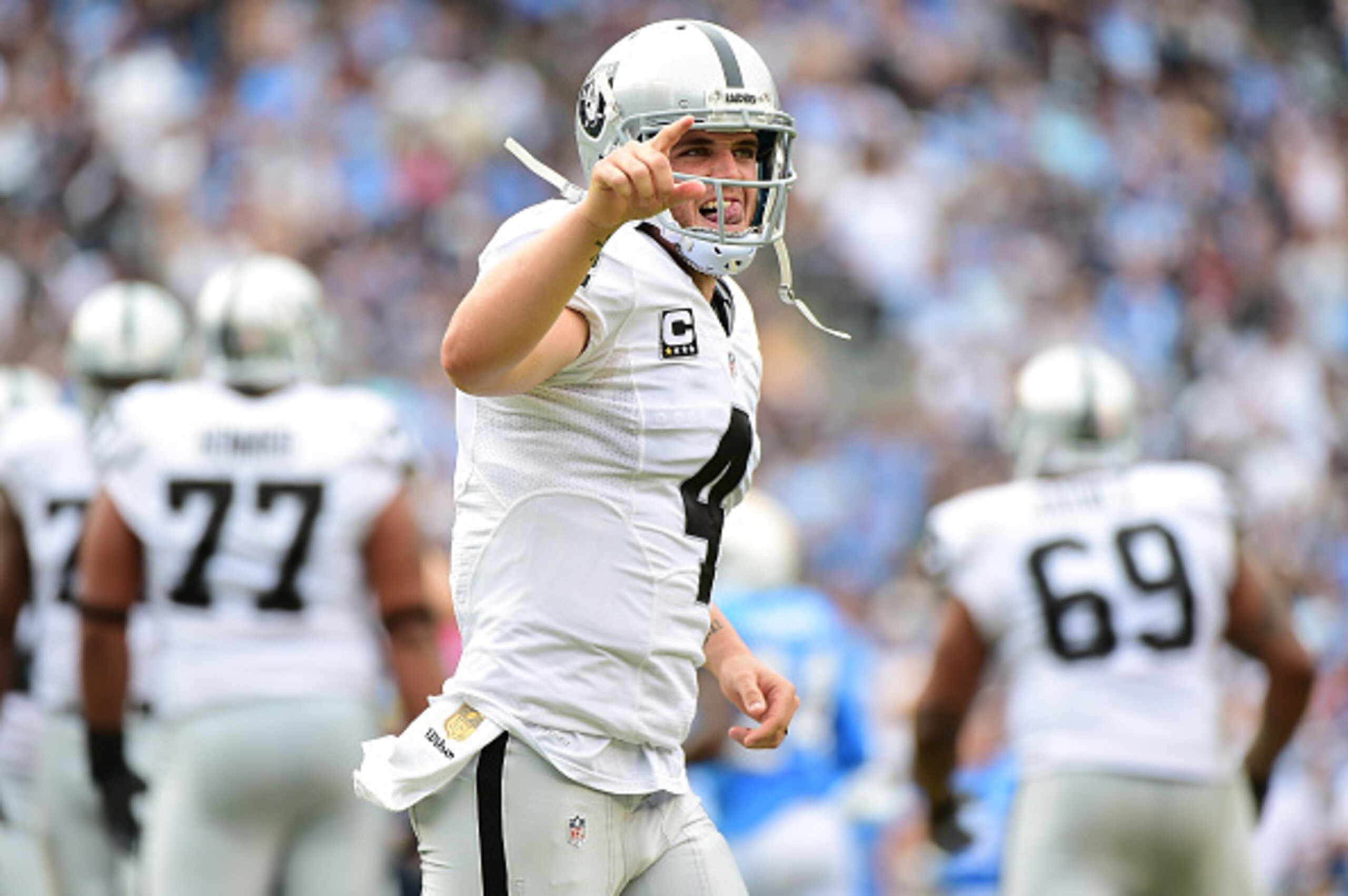 SAN DIEGO, CA - OCTOBER 25:  Derek Carr #4 of the Oakland Raiders celebrates his touchdown pass to Clive Walford #88 during the second quarter against the San Diego Chargers at Qualcomm Stadium on October 25, 2015 in San Diego, California.  (Photo by Harr