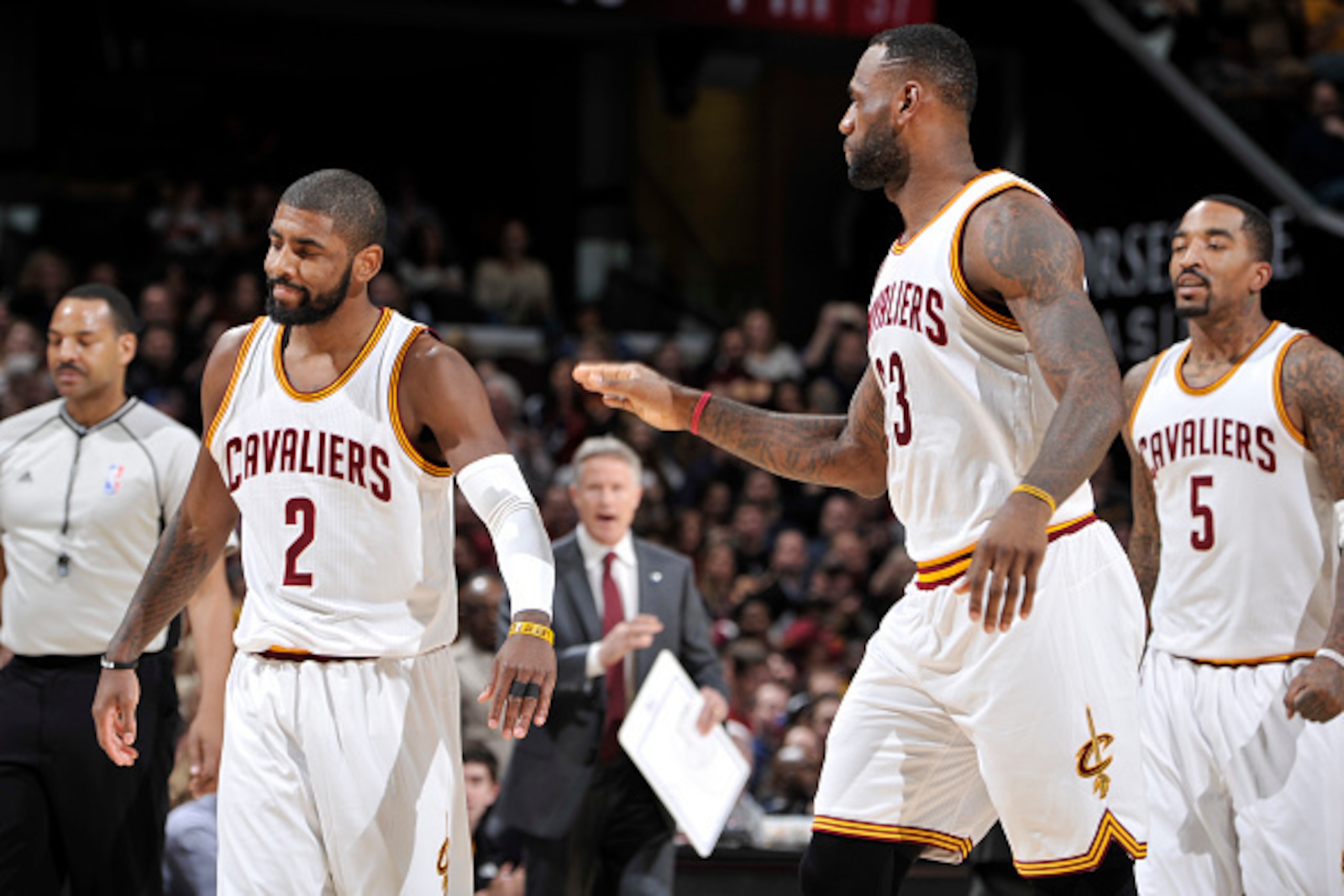 CLEVELAND, OH - DECEMBER 20: Kyrie Irving #2 of the Cleveland Cavaliers high fives LeBron James #23 during the game against the Philadelphia 76ers on December 20, 2015 at Quicken Loans Arena in Cleveland, Ohio. NOTE TO USER: User expressly acknowledges an