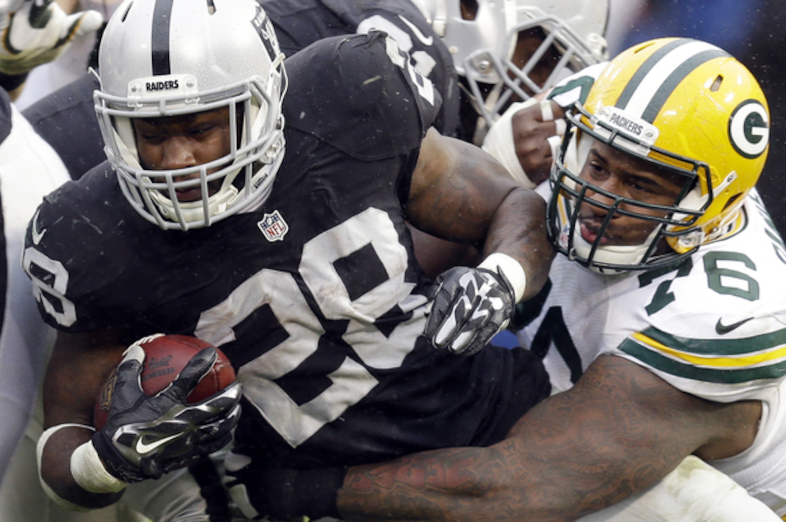 Oakland Raiders running back Latavius Murray extends himself for extra yards against the Green Bay Packers in Week 15.