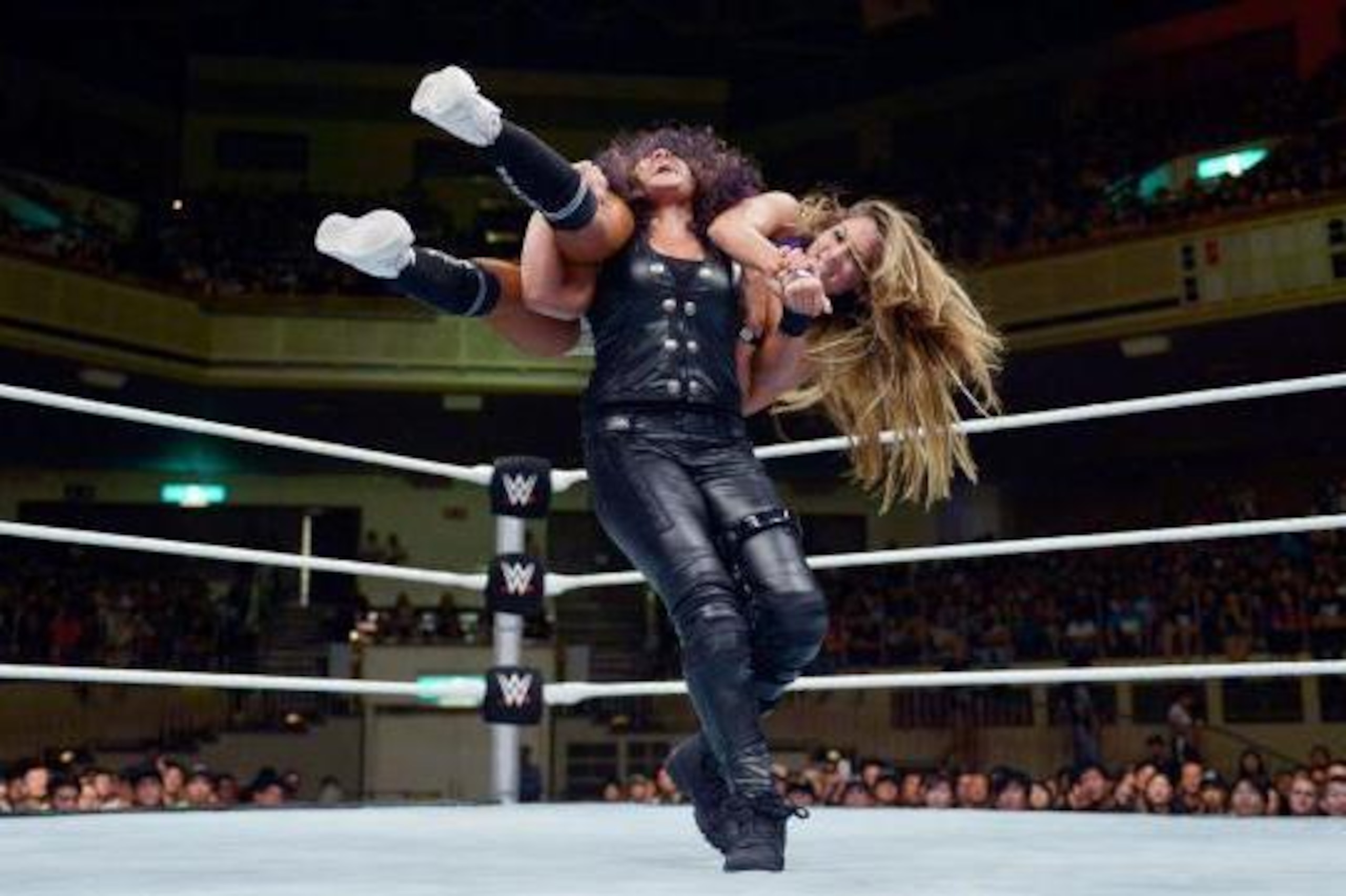 Tamina Snuka drops Nikki Bella to the mat.