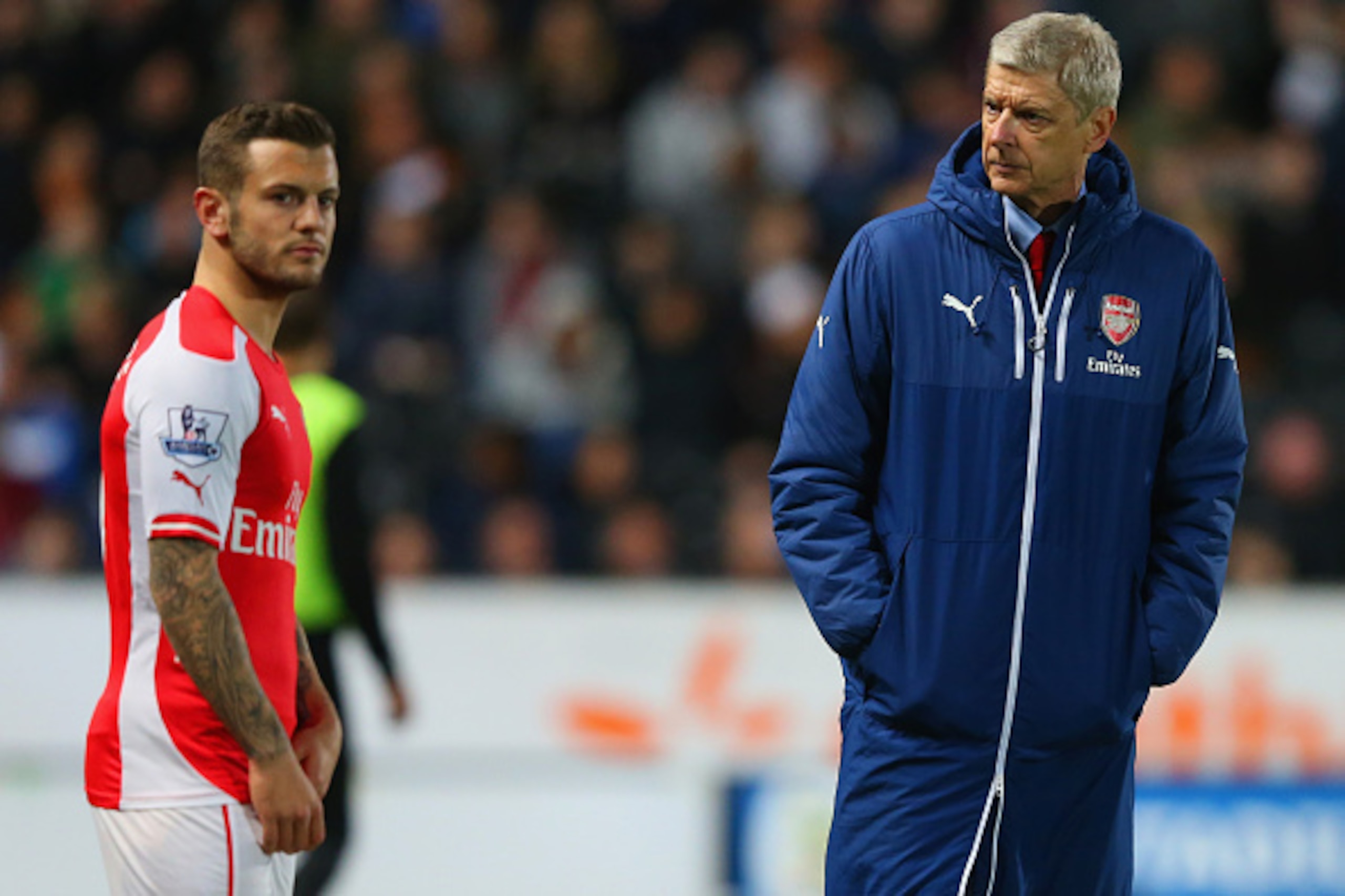 HULL, ENGLAND - MAY 04:  Arsene Wenger manager of Arsenal looks on as Jack Wilshere of Arsenal prepares to come onto the pitch during the Barclays Premier League match between Hull City and Arsenal at KC Stadium on May 4, 2015 in Hull, England.  (Photo by
