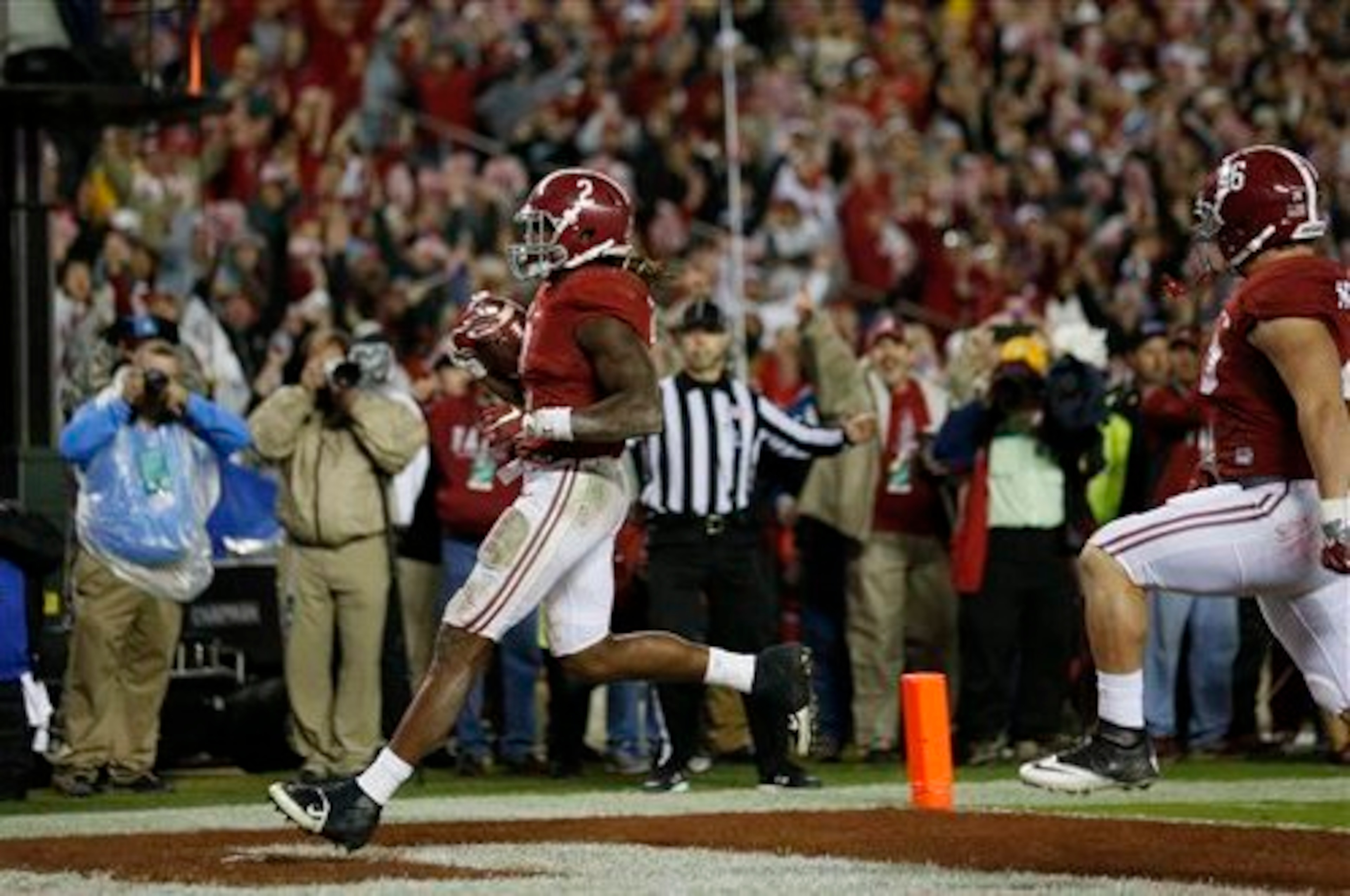 Michael Nysewander high-steps into the end zone after making a block of Derrick Henry at LSU.