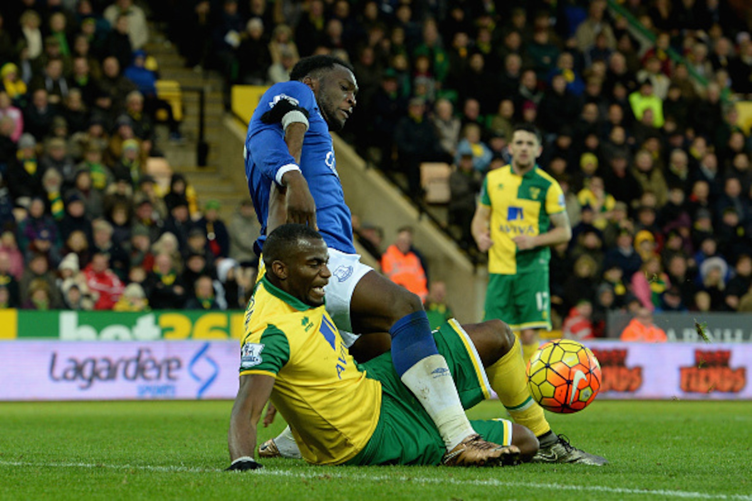 Sebastien Bassong of Norwich City  tackles Romelu Lukaku of Everton during the Barclays Premier League match between Norwich City and Everton at Carrow Road on December 12 2015 in Norwich, United Kingdom.