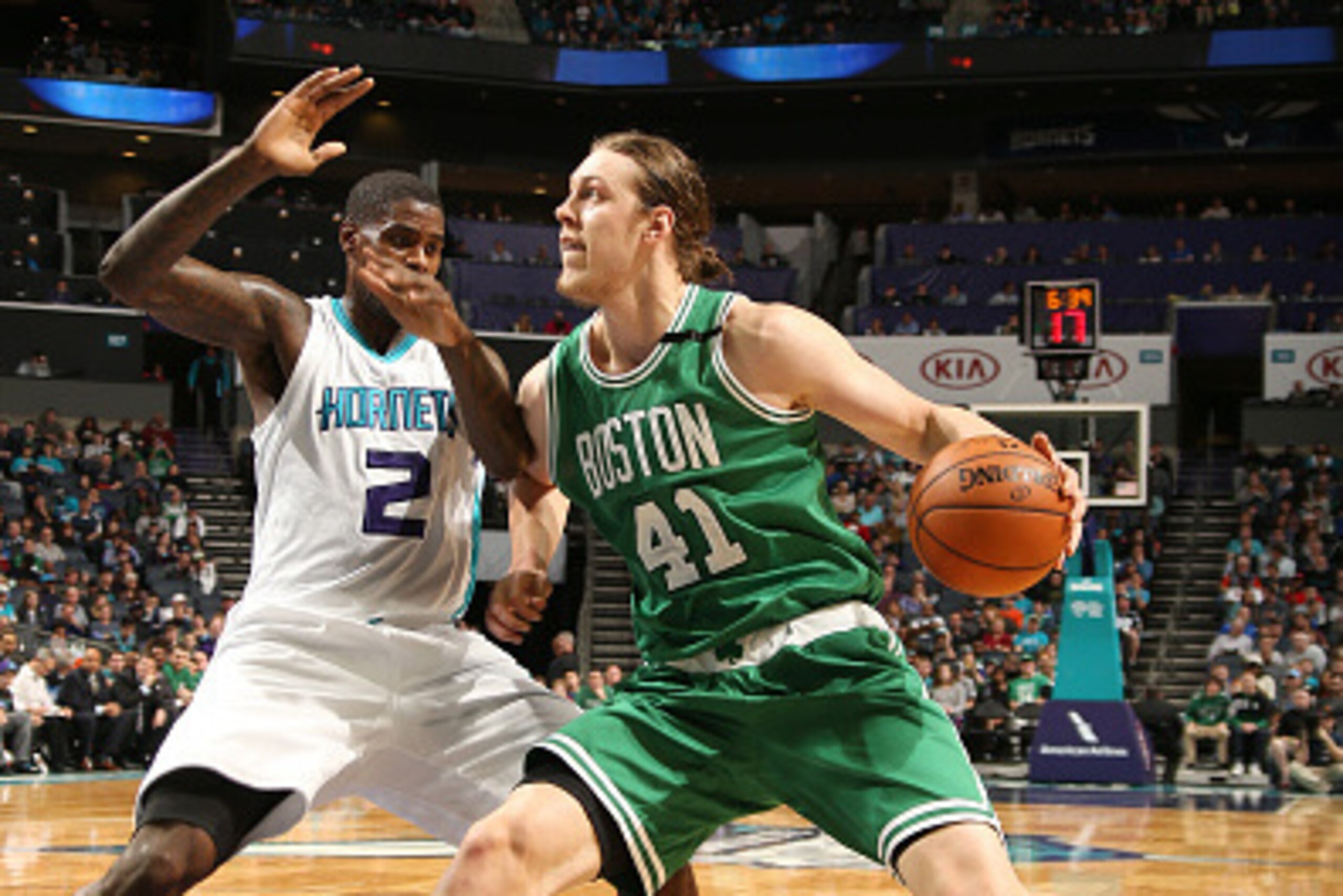 CHARLOTTE, NC - DECEMBER 23: Kelly Olynyk #41 of the Boston Celtics handles the ball during the game against the Charlotte Hornets on December 23, 2015 at Time Warner Cable Arena in Charlotte, North Carolina. NOTE TO USER: User expressly acknowledges and 