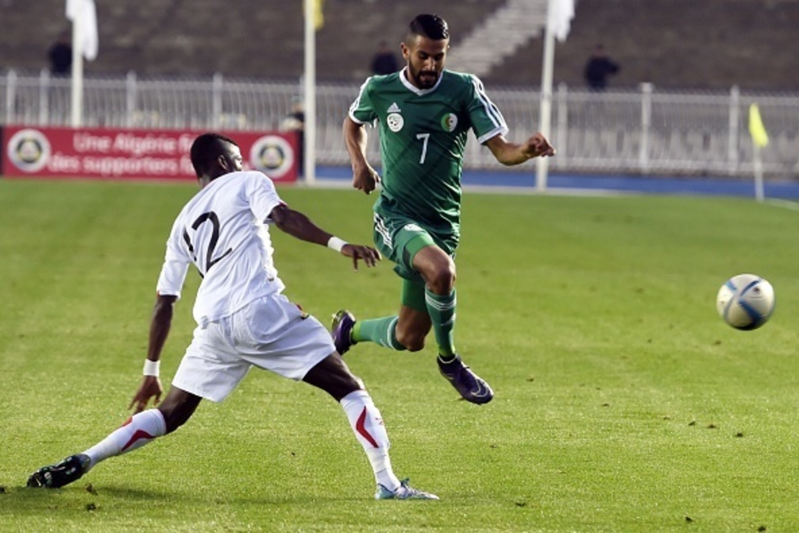 Algeria's Riyad Mahrez vies with Guinea's Ibrahima Sory Conte (L) during the friendly football match Algeria versus Equatorial Guinea as part of the teams' preparation for the 2018 World Cup playoffs on October 9, 2015 at the 5 July Stadium in Algiers.   