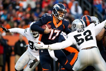 DENVER, CO - DECEMBER 13:  Quarterback Brock Osweiler #17 of the Denver Broncos scrambles away from defensive end Khalil Mack #52 and defensive end Benson Mayowa #95 of the Oakland Raiders during a game at Sports Authority Field at Mile High on December 1