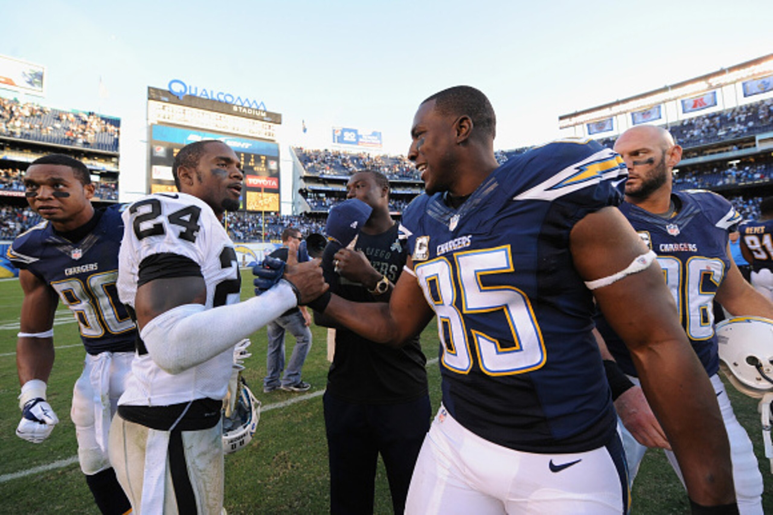 SAN DIEGO, CA - NOVEMBER 16:   Charles Woodson #24 of the Oakland Raiders congratulated  Antonio Gates #85 of the San Diego Chargers after the Chargers defeated the Oakland Raiders 13-6 in the game at Qualcomm Stadium on November 16, 2014 in San Diego, Ca