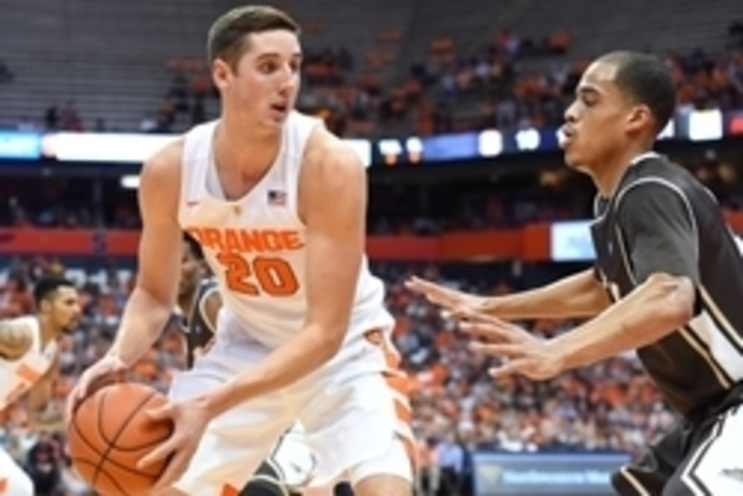 Nov 17, 2015; Syracuse, NY, USA; Syracuse Orange forward Tyler Lydon (20) controls the ball against the defense of St. Bonaventure Bonnies forward Dion Wright (21) during the first half at the Carrier Dome.  Syracuse defeated St. Bonaventure 79-66.  Manda