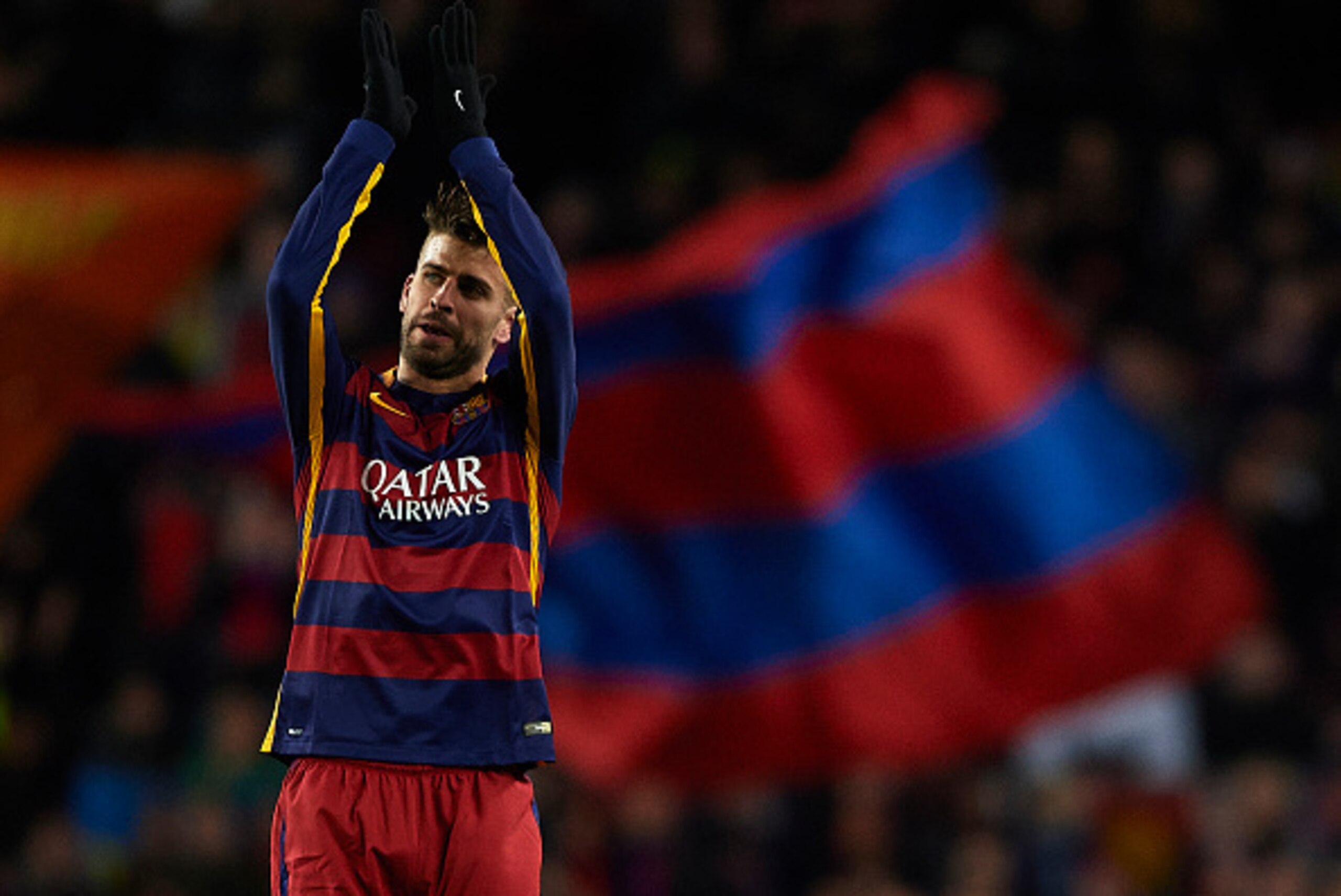 BARCELONA, SPAIN - NOVEMBER 24:  Gerard Pique of Barcelona greets the fans during the UEFA Champions League Group E match between FC Barcelona and AS Roma at Camp Nou on November 24, 2015 in Barcelona, Spain.  (Photo by Manuel Queimadelos Alonso/Getty Ima
